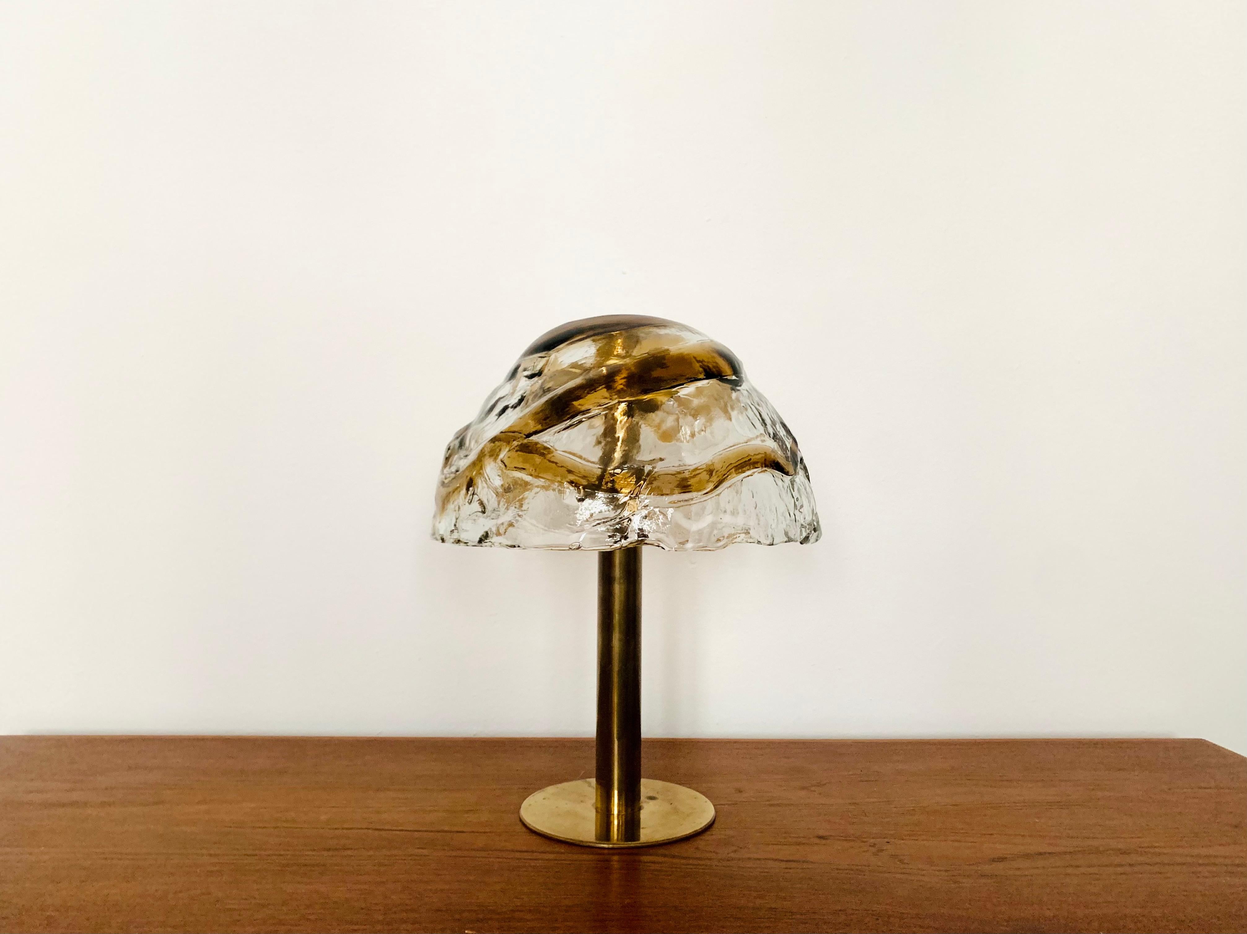 Stunning Murano glass table lamp from the 1960s.
The heavy two-tone structured glass spreads an impressive sparkling play of light.
Very high quality workmanship and fantastic design.

Design: J.T. Kalmar

Condition:

Very good vintage