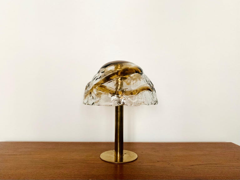 Stunning Murano glass table lamp from the 1960s.
The heavy two-tone structured glass spreads an impressive sparkling play of light.
Very high quality workmanship and fantastic design.

Design: J.T. Kalmar

Condition:

Very good vintage