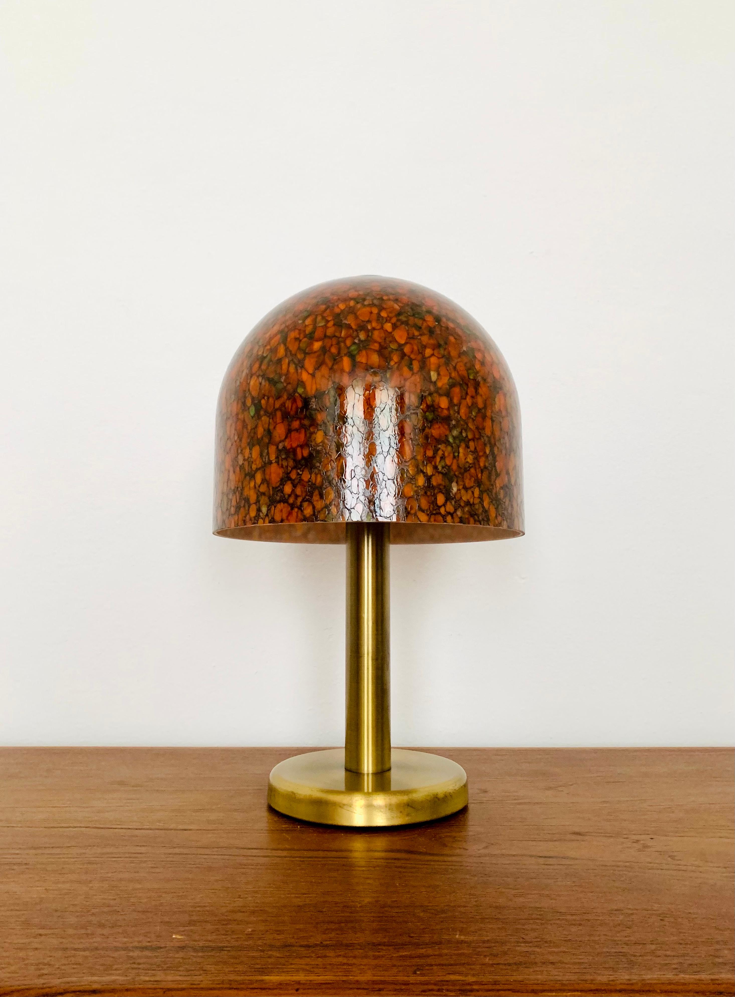 Very nice glass of table lamp from the 1960s.
The lamp is very noble and a highlight for every room due to the design.
A pleasant light is created.

Condition:

Very good vintage condition with slight signs of wear.
Signs of wear on the brass foot