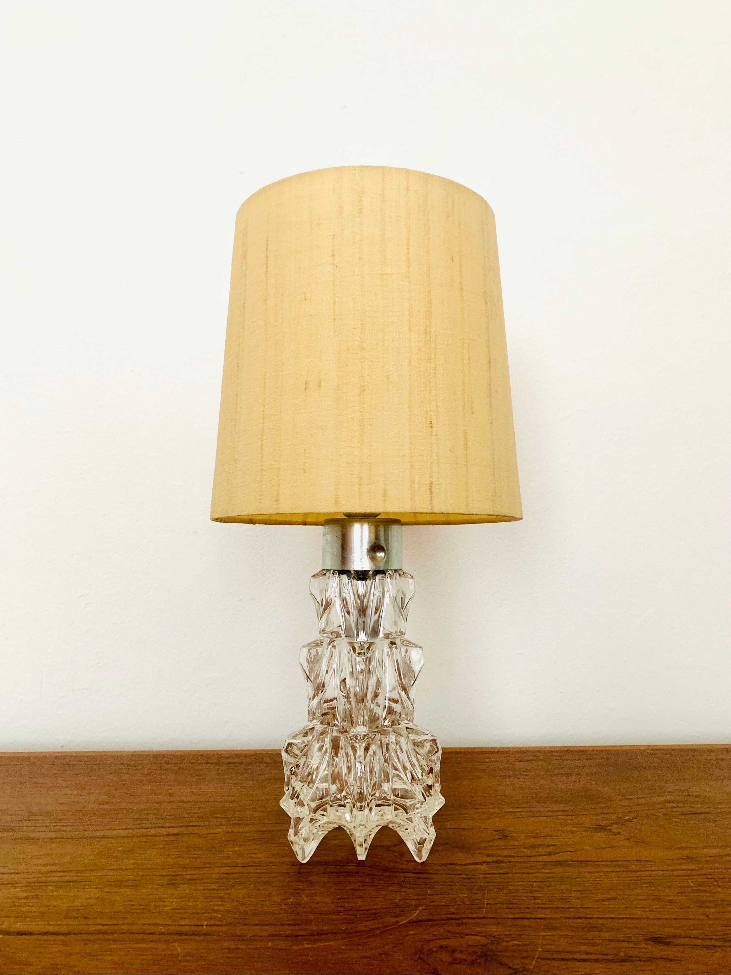 Stunning Murano glass table lamp from the 1960s.
The illuminated glass base creates an impressive sparkling light display.
Very high quality workmanship and fantastic design.

Condition:

Very good vintage condition with slight signs of age-related
