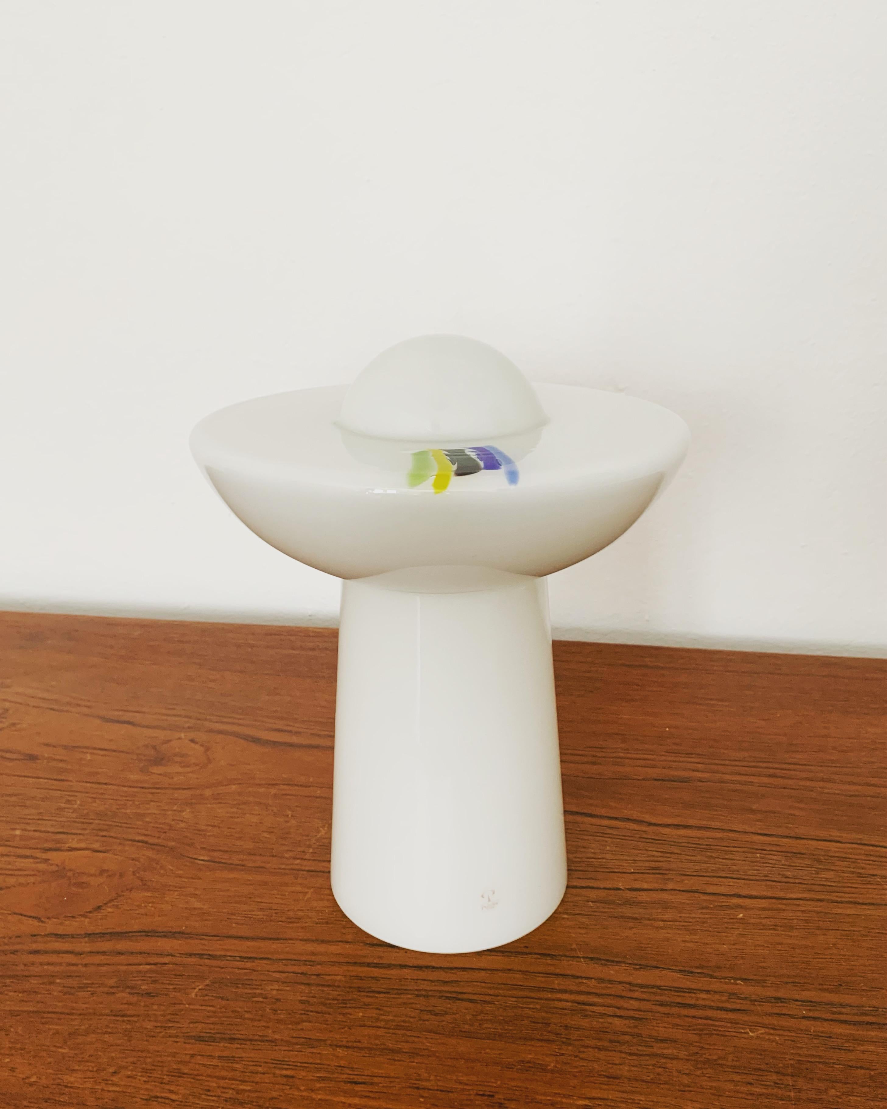 Very nice opal glass table lamp from the 1960s.
The lamp is very noble and a very special design object.
A pleasant light is created.

Manufacturer: Peill and Putzler

Condition:

Very good vintage condition with slight signs of wear consistent with