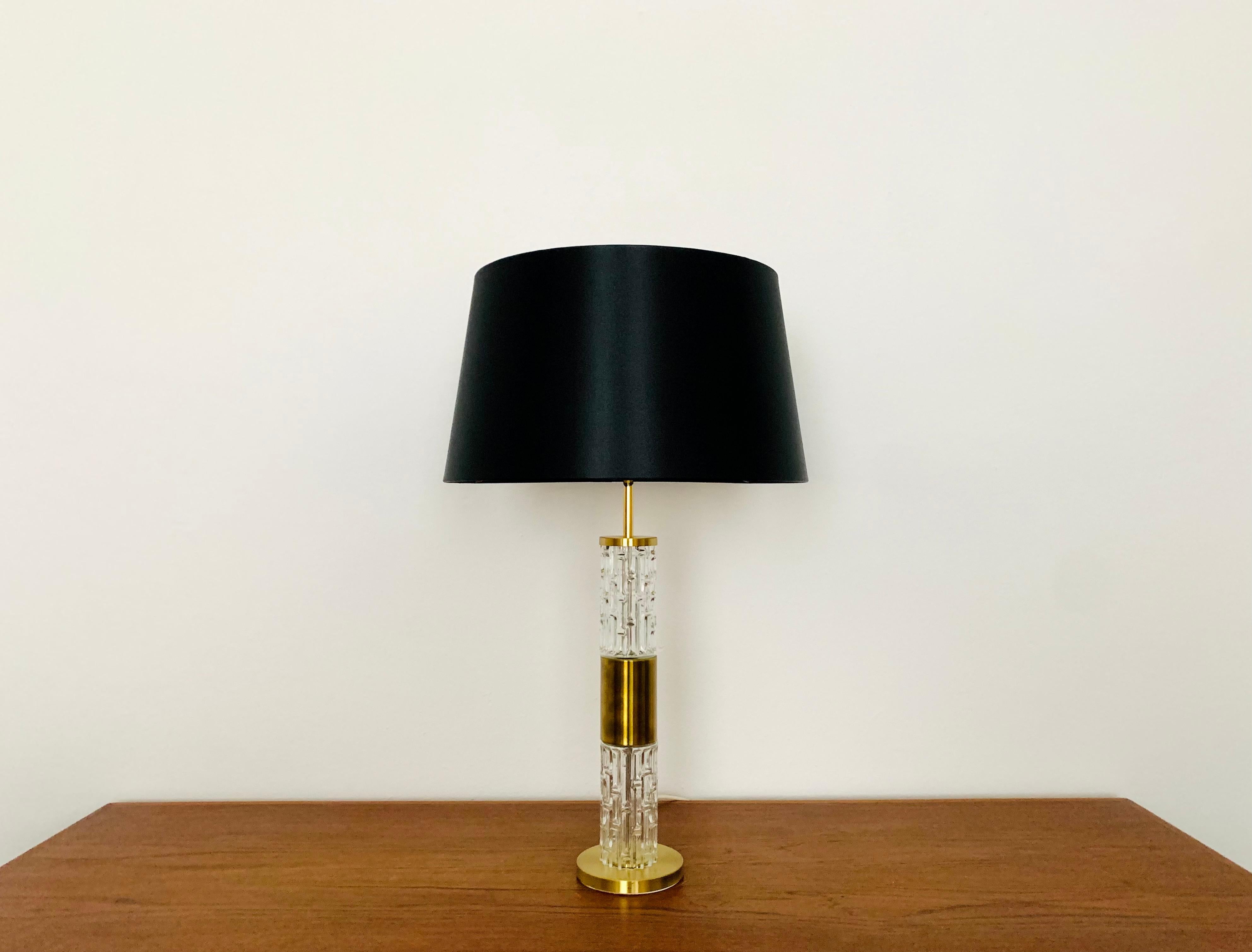 Very nice glass table lamp by Doria from the 1960s.
Very elegant Hollywood Regency design with a fantastically glamorous look.

Manufacturer: Doria

Condition:

Very good vintage condition with slight signs of wear consistent with age.
The