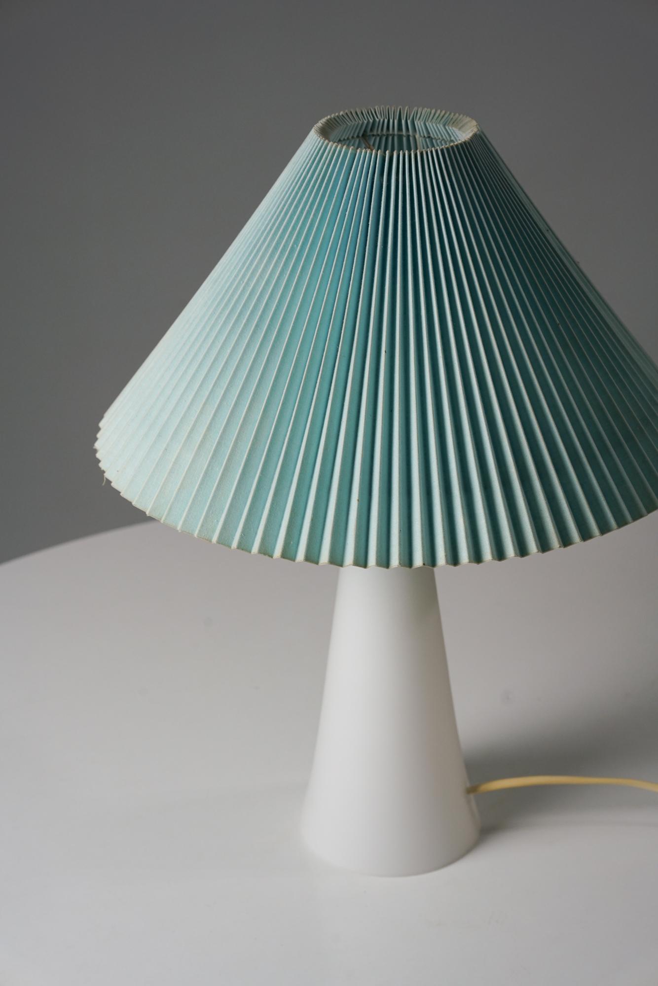 Glass table lamp by Lisa Johansson-Pape for Orno Oy from the 1950s. Glass frame with fabric lampshade. Good vintage condition, minor patina and wear consistent with age and use. Classic Scandinavian Modern piece by Lisa Johansson-Pape. 