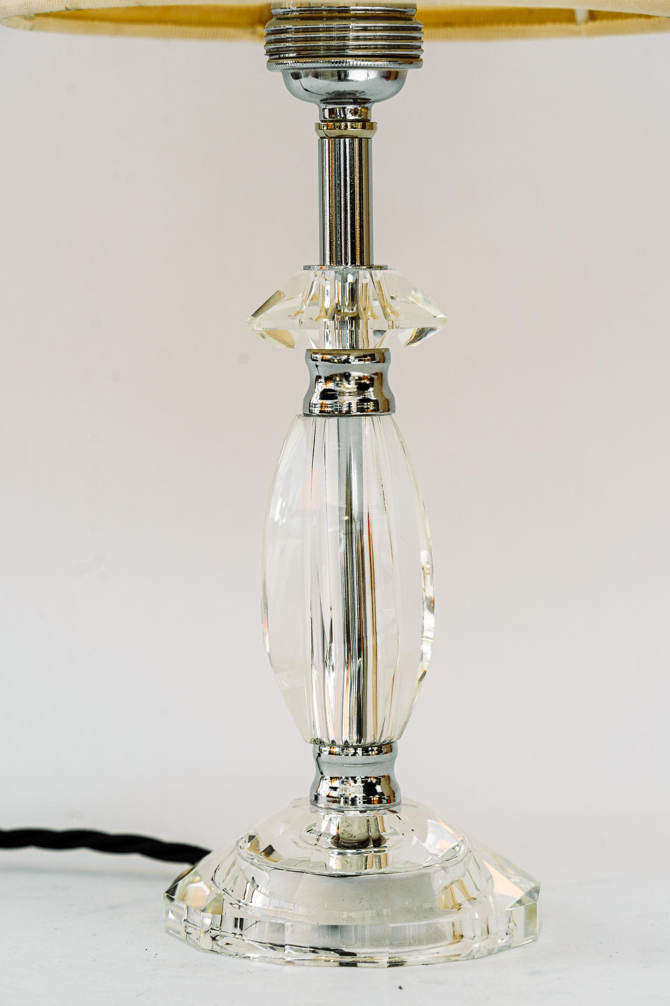 Glass table lamp with chrome parts and fabric shade vienna around 1960s
The fabric shade is replaced ( new )