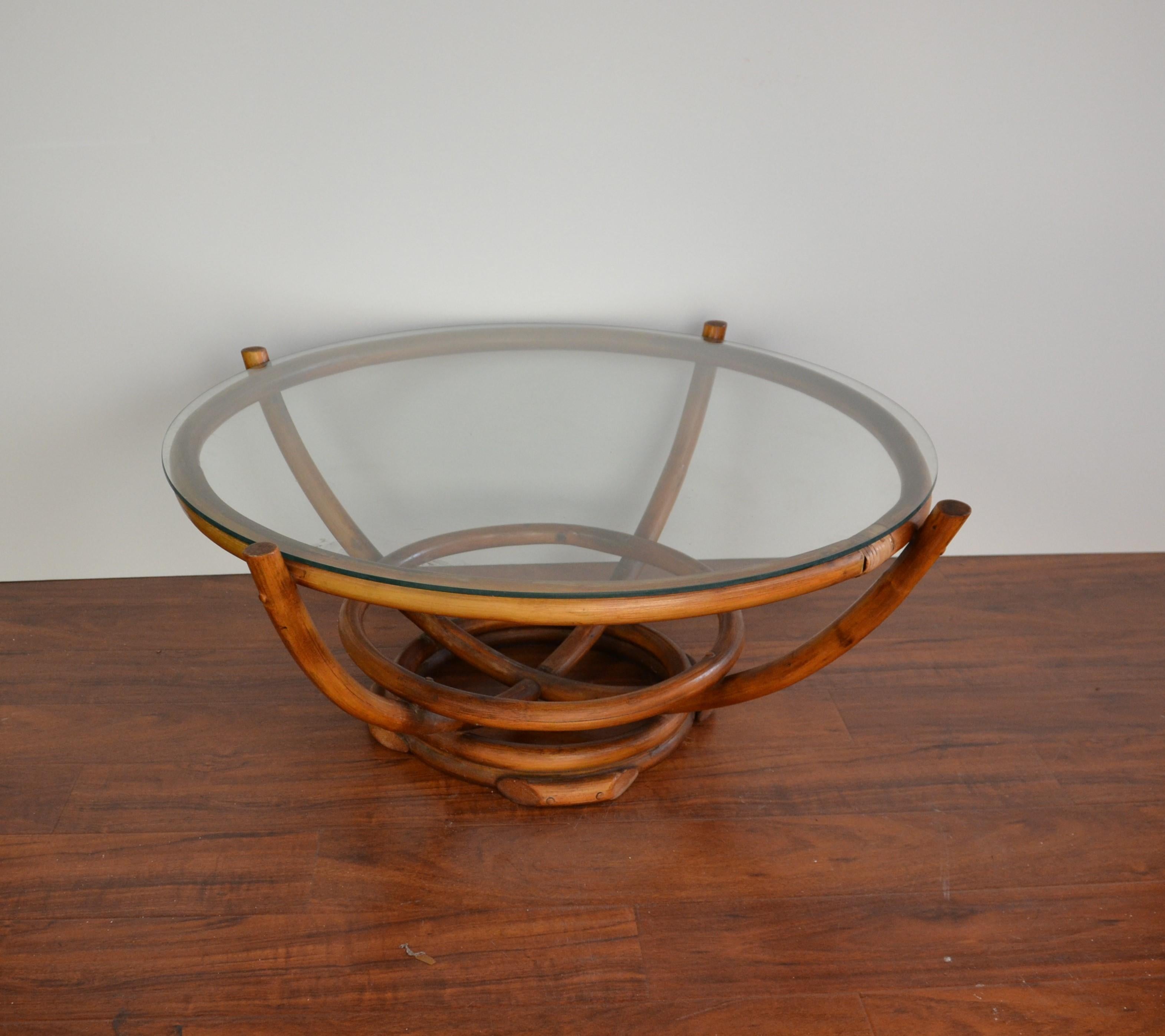 Round shape glass top bamboo table.