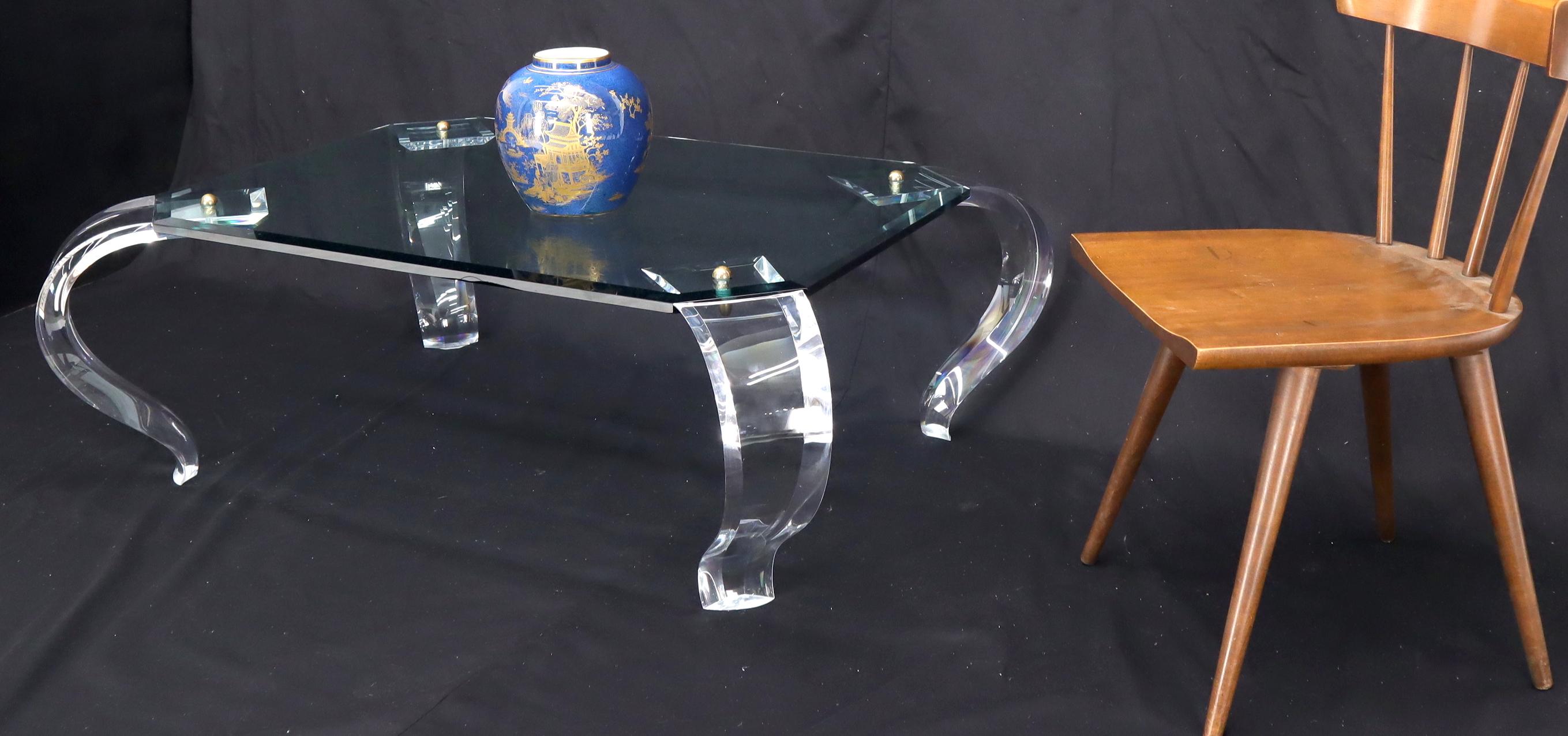 Mid-Century Modern glass top carved Lucite cabriole leg rectangular coffee table.
The legs are secured and brass ball finial decorative fastener and the whole table easily comes apart.
     