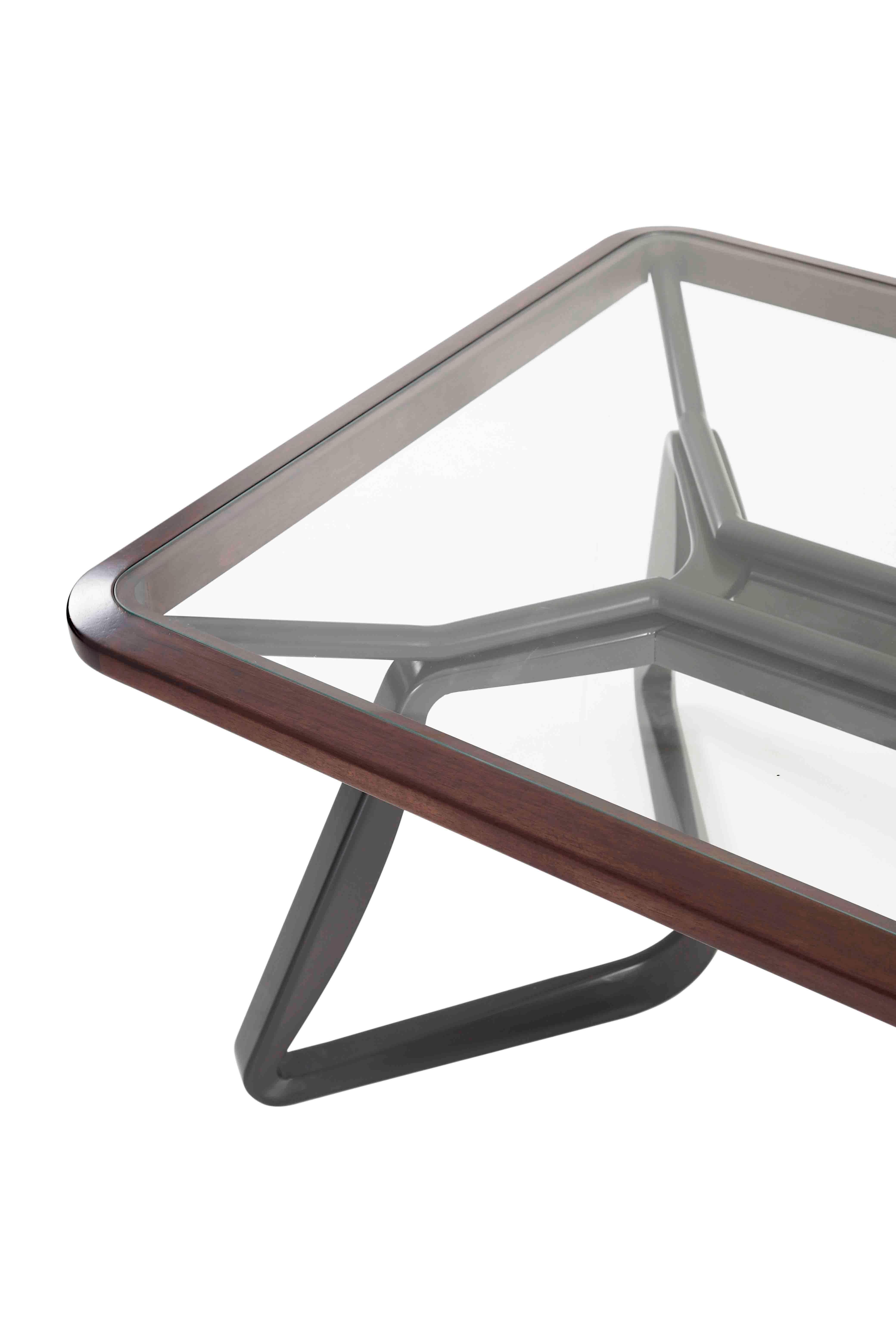 Featuring a metal frame, our dining table time with glass top gives it a light look that pairs well with upholstered chairs

Key details: Clear glass top, wood, and metal
Made in Brazil
Structure: Black metal
Top: laminated glass and wood
Care: Dust