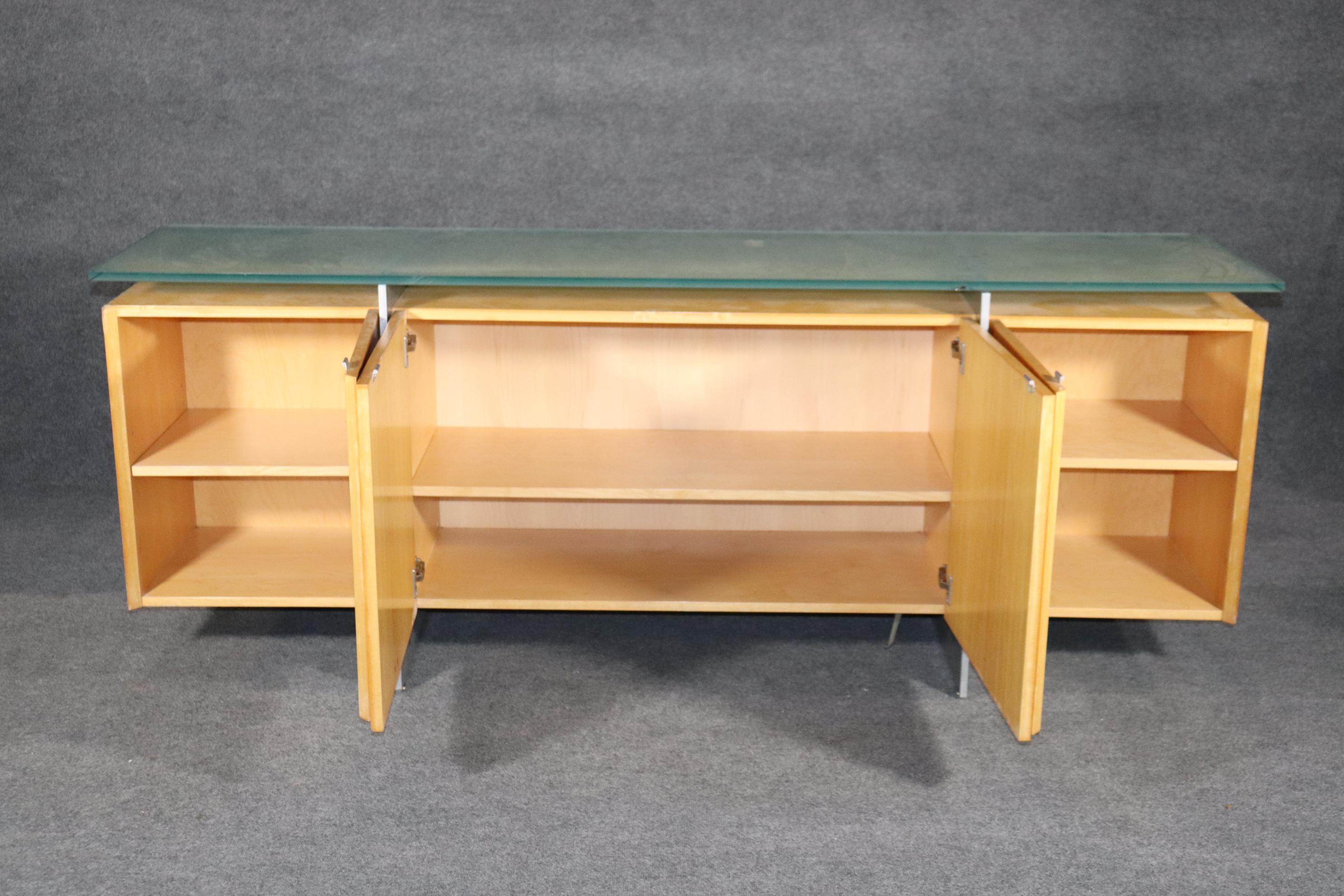 Sleek sideboard with frosted glass top and metal legs. Comes out of Vladimir Kagan's workshop!
Please confirm location NY or NJ.