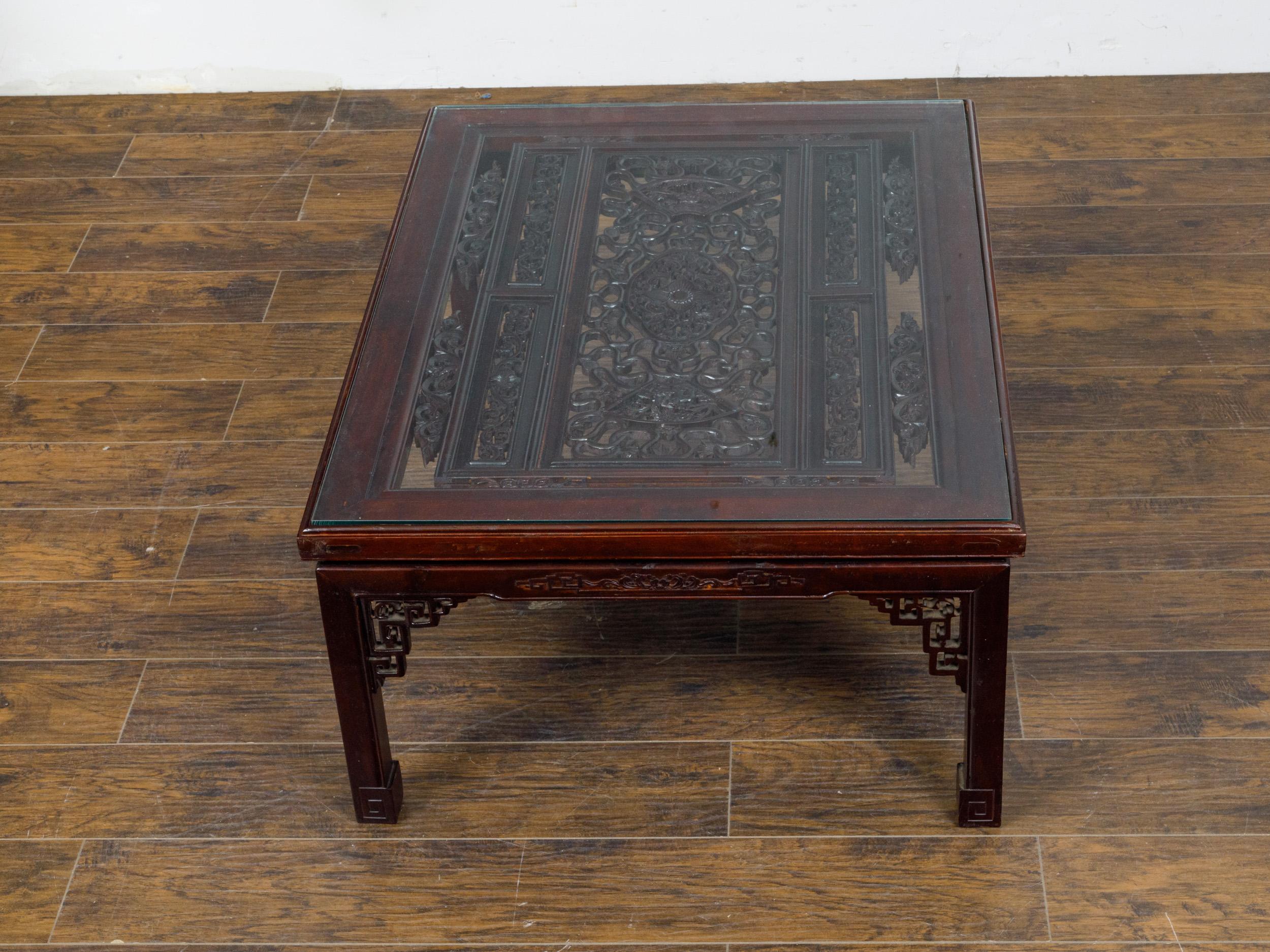 Glass Top Coffee Table with Fretwork Motifs and Scrolling Feet, circa 1950 In Good Condition For Sale In Atlanta, GA