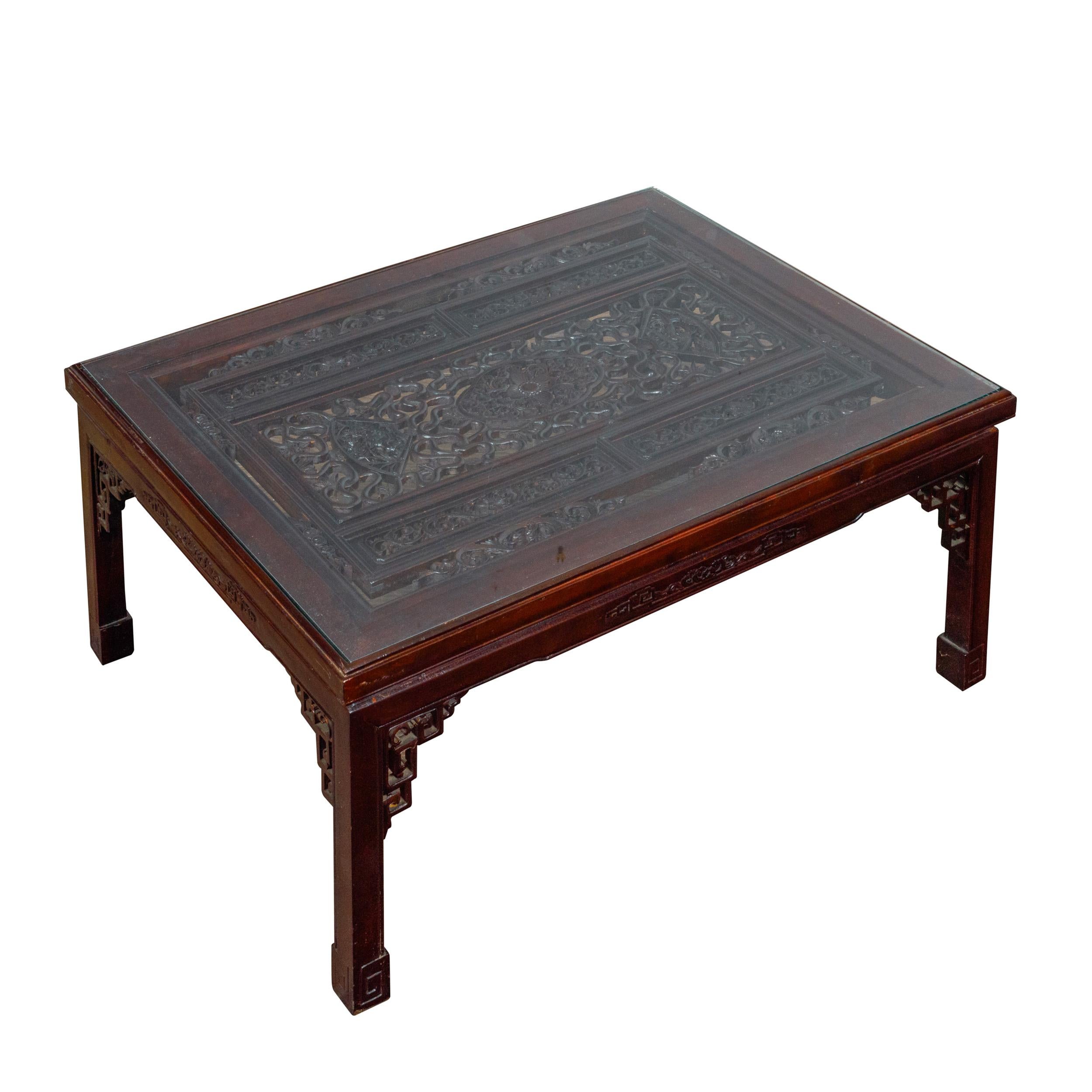 Glass Top Coffee Table with Fretwork Motifs and Scrolling Feet, circa 1950 For Sale