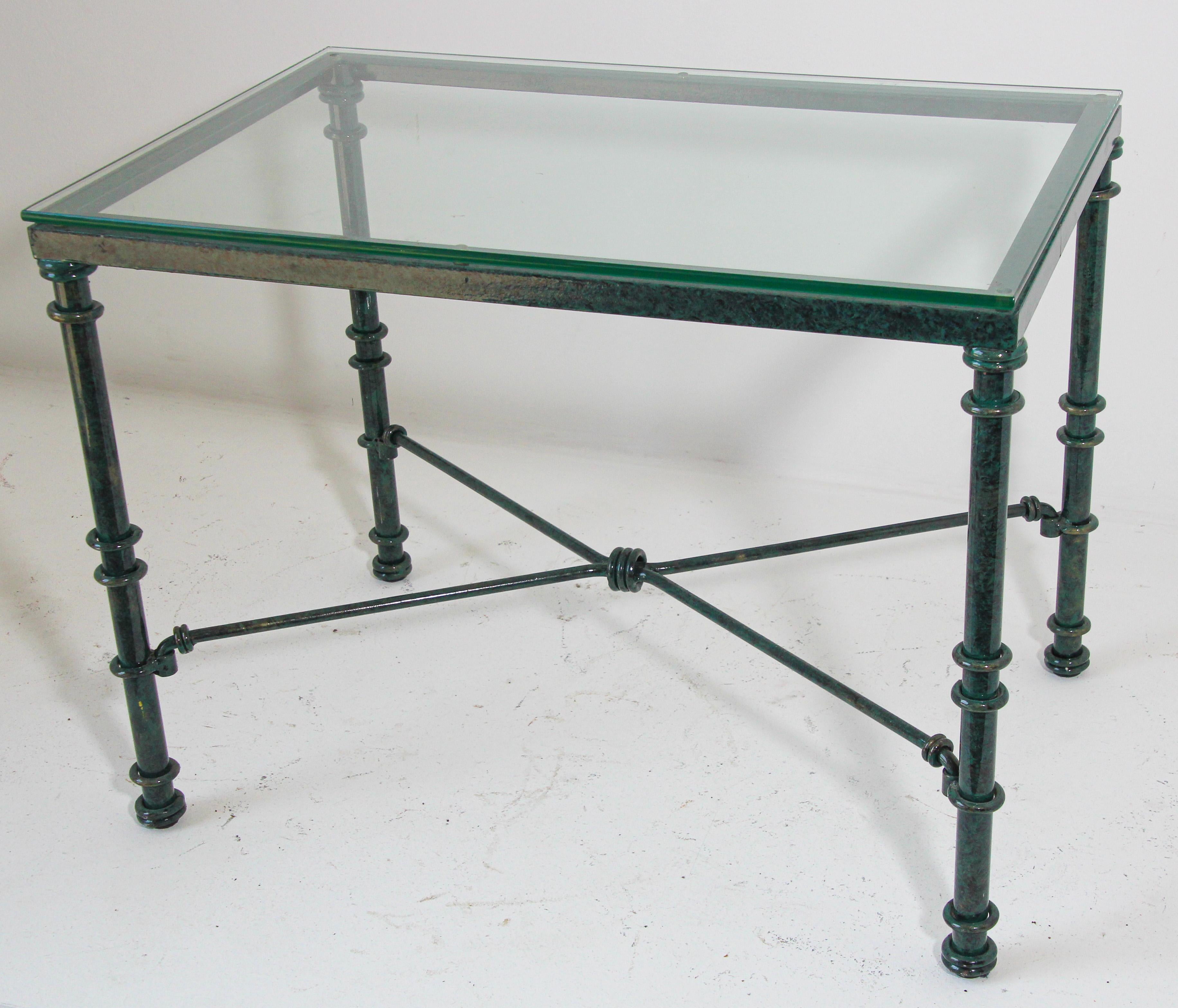 Giacometti inspired metal and glass top coffee table with verdigris style finish paint patina.

Vintage coffee table, with patinated painted aluminum forged base with a removable center 