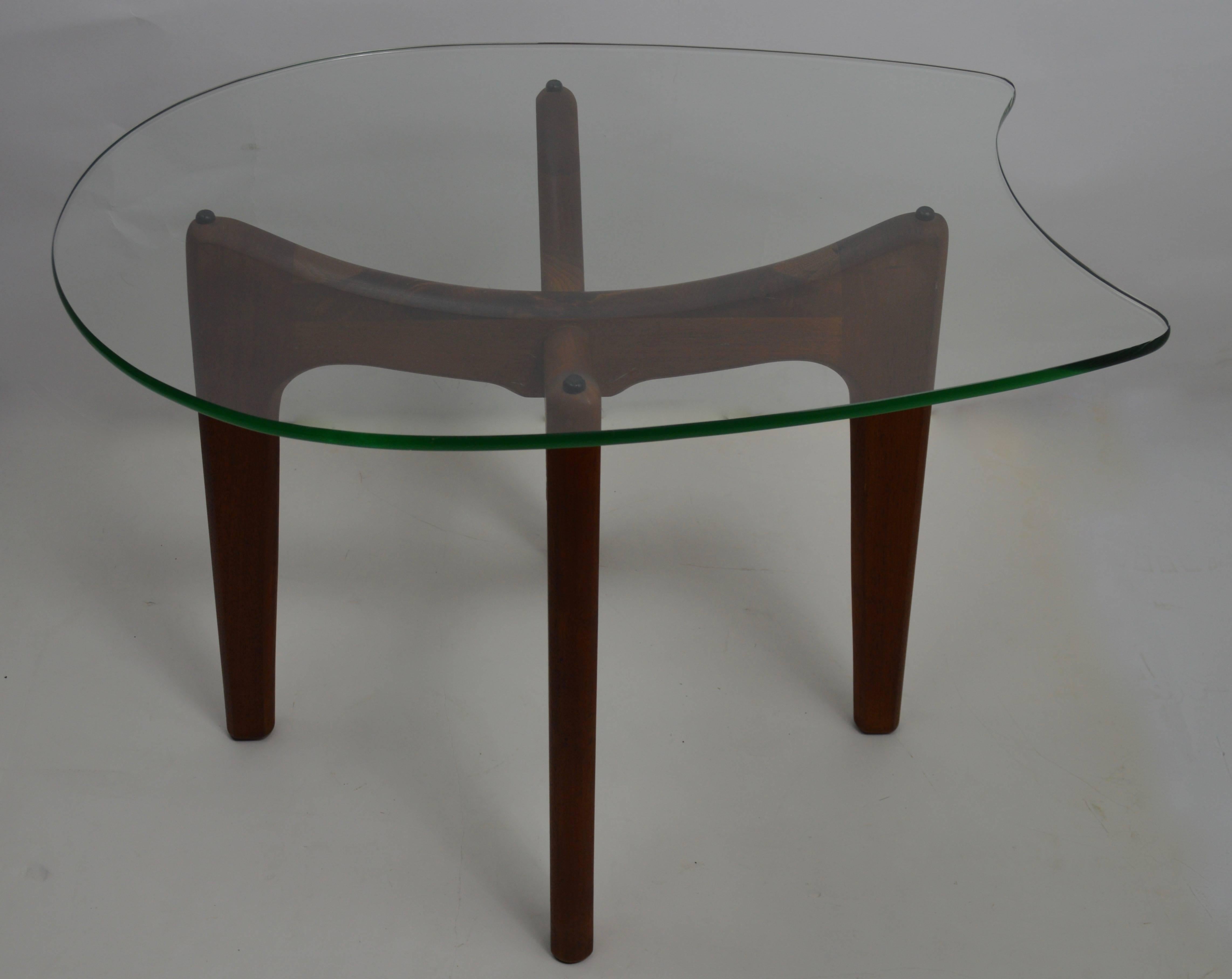 Classic glass top table with sculptural wood base designed by Adrian Pearsall for Craft Associates.
This example is in very fine, clean and original condition, ready to use.
Glass top .50 in. thick.
 
 