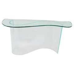 Glass top entryway console table on lucite wave base