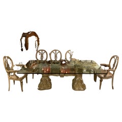 Glass top on silver gilt double pedestal base with ten chairs
