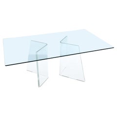 Table de salle à manger rectangulaire avec plateau en verre et bases à piédestaux asymétriques en lucite