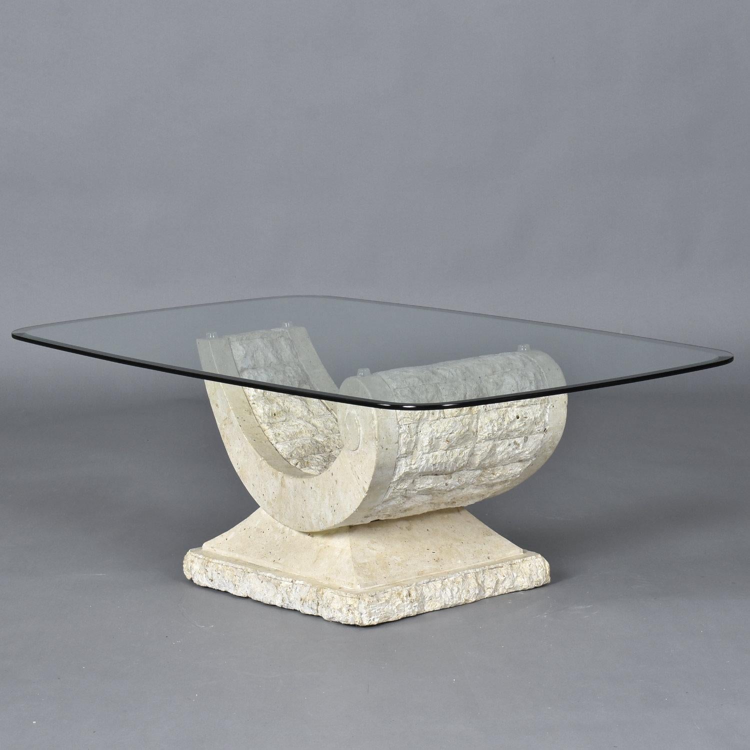 Elegantly curved tessellated stone coffee table. The table base is made of Mactan stone, a type of coral. It seems fitting that this base made of coral mimics the graceful contour of a seashell. Made in the Philippines, vintage 1980s, the table