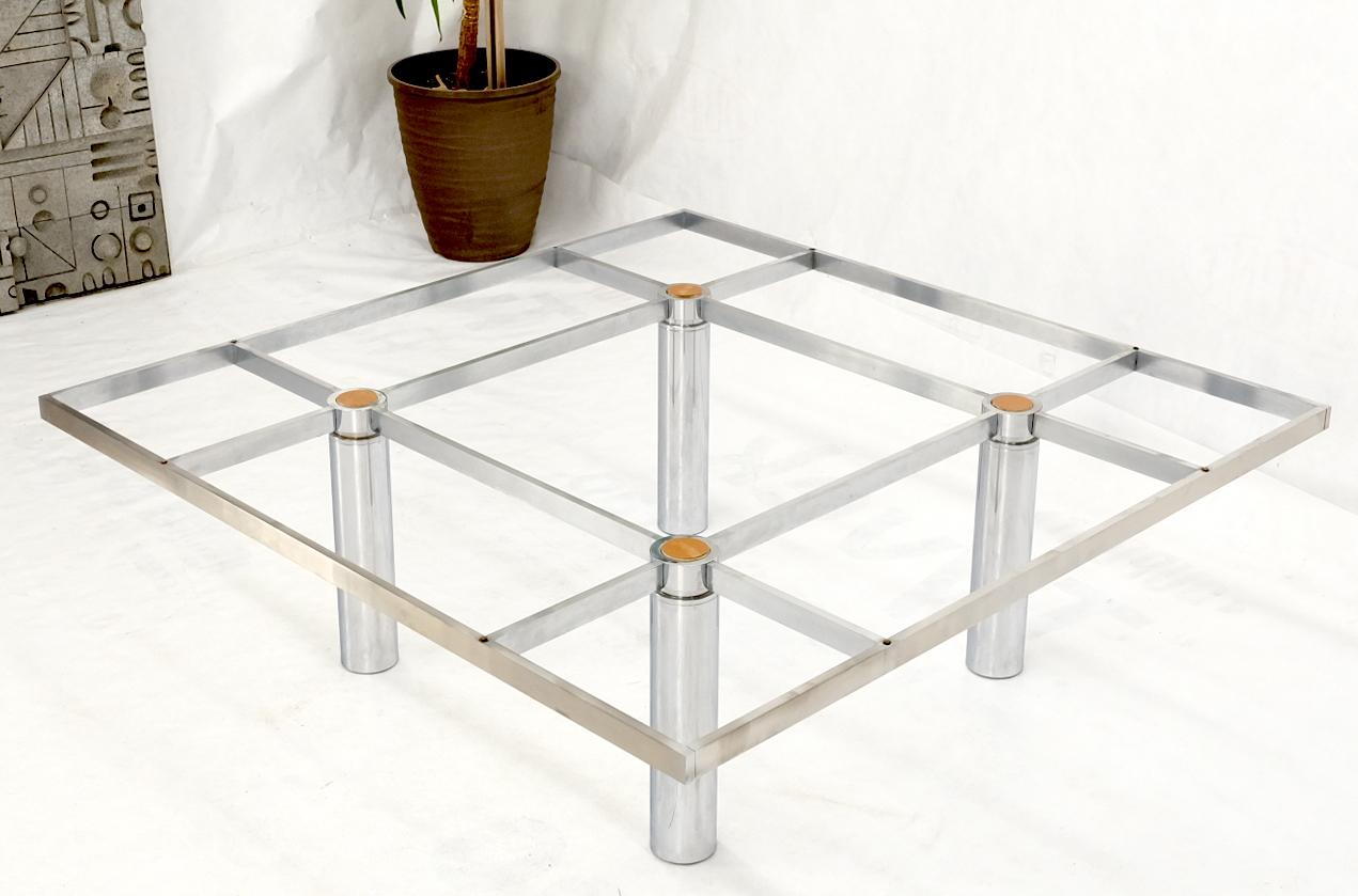 Mid-Century Modern heavy chrome base glass top square coffee table by Knoll on cylinder shape legs.