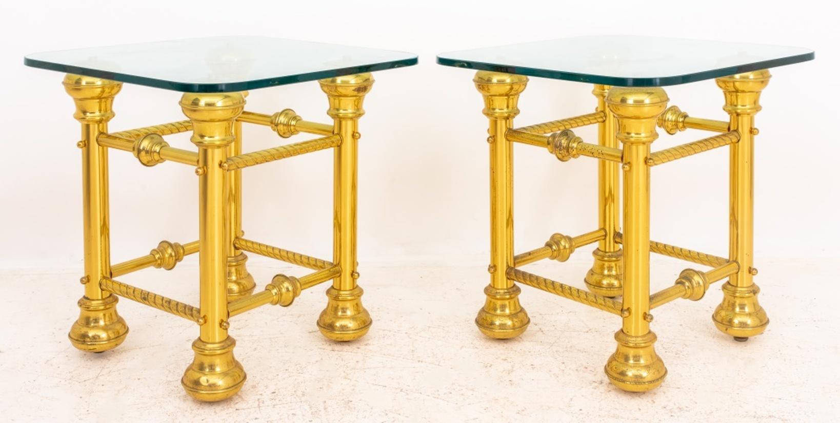 Glass-topped brass end tables, likely fashioned from re-purposed Victorian brass railing segments, and topped with custom glass tops. Set of 2.

Dimensions: 24