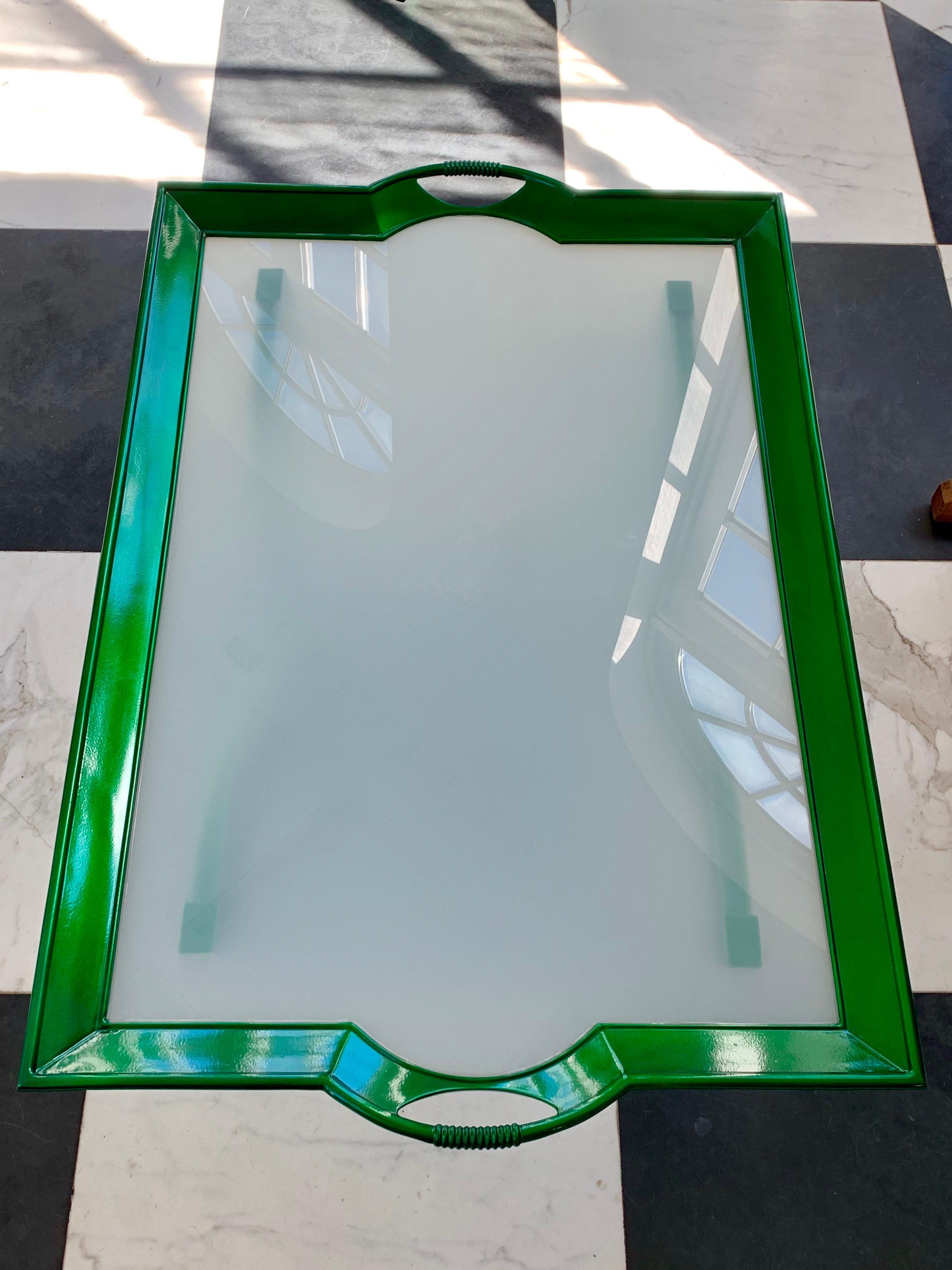 This is a La Barge glass “Tray” coffee table we had it powder coated in an emerald green color.
The powder coating process allows it to be used inside or outdoors. It won’t rust.
There are no scratches to the glass as we had it replaced as well the