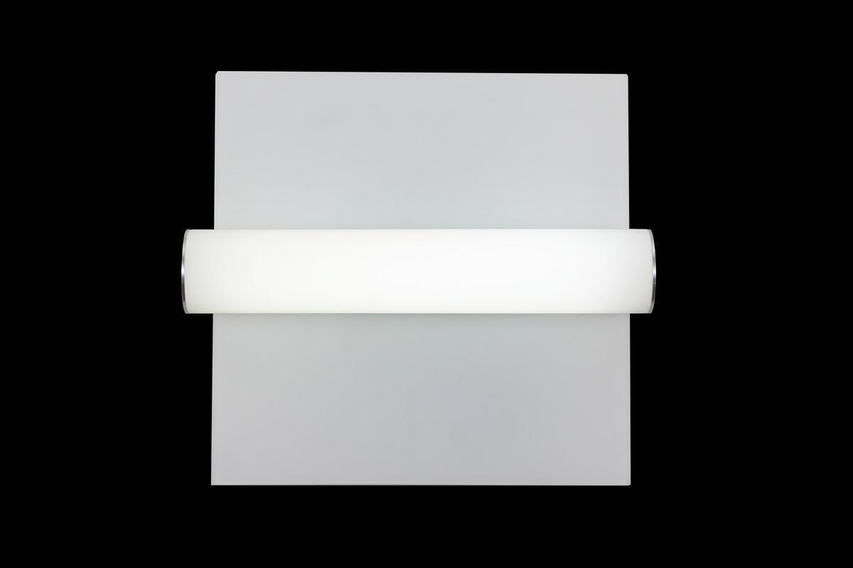 Glass tube shade with rectangular glass backplate/reflector. Satin aluminum caps on sides. Can be vertically or horizontally mounted. In the manner of streamline moderne. LED lamping, standard color temperature 3000k.

Architect, Sandy Littman of