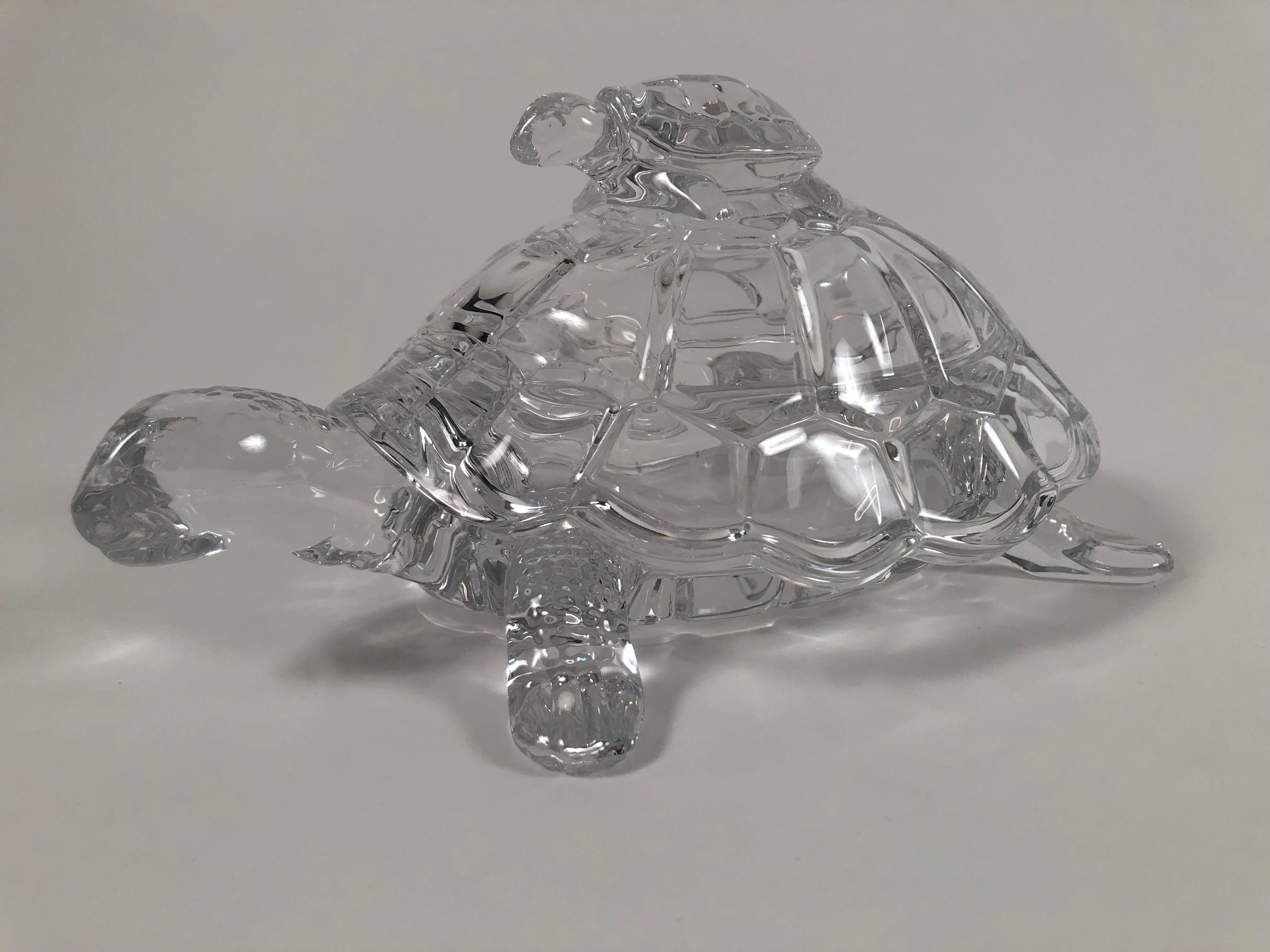 A well modeled clear glass turtle form candy dish, the removable top with baby turtle finial enclosing an oval footed dish which is perfect for serving candy or nuts. Very nice quality, good weight and form, in excellent condition.