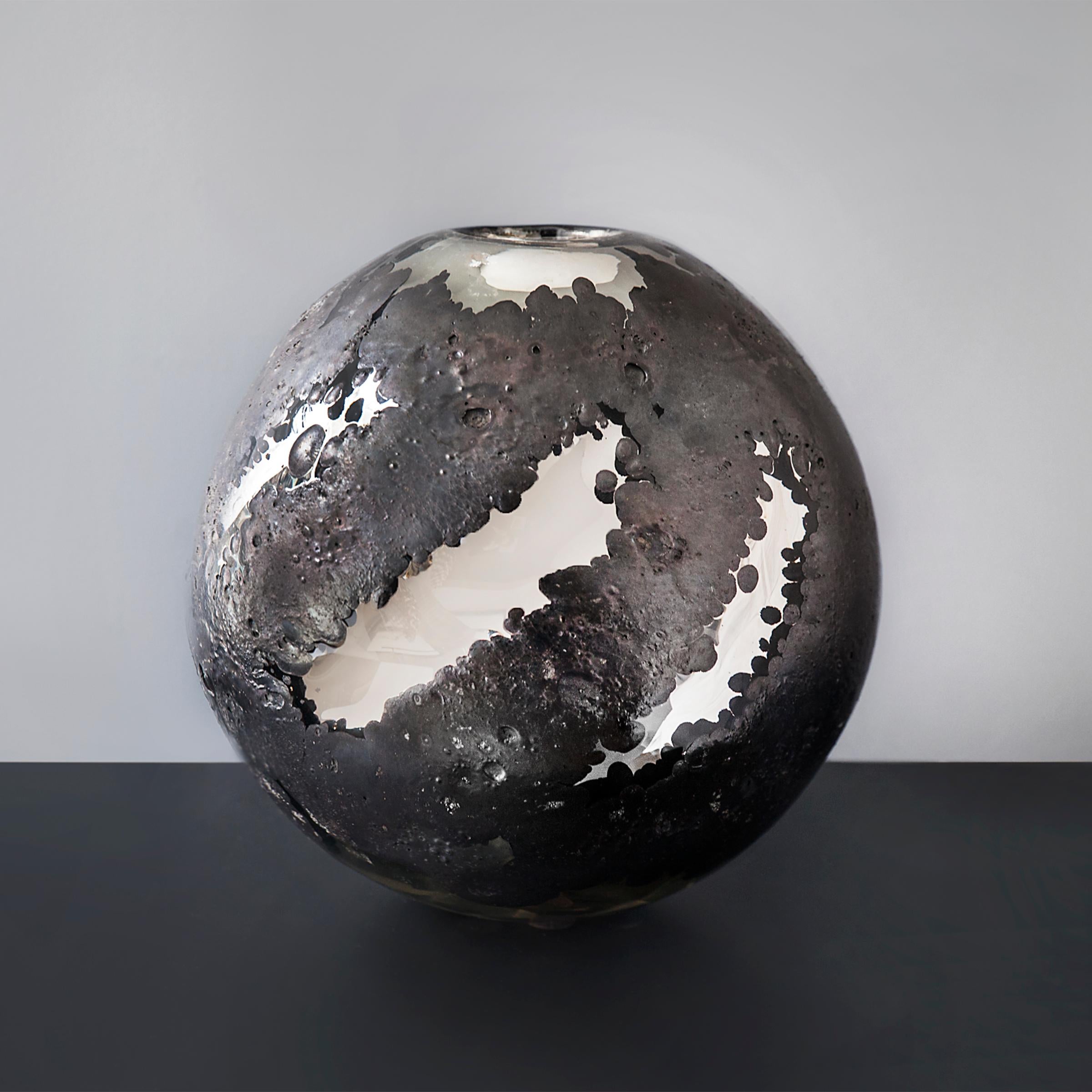 Hand blown Murano glass vase by Franco Deboni, Italy, 2016, with matte black cratered surface opening to reveal a mirrored glass interior, signed and dated to the underside.