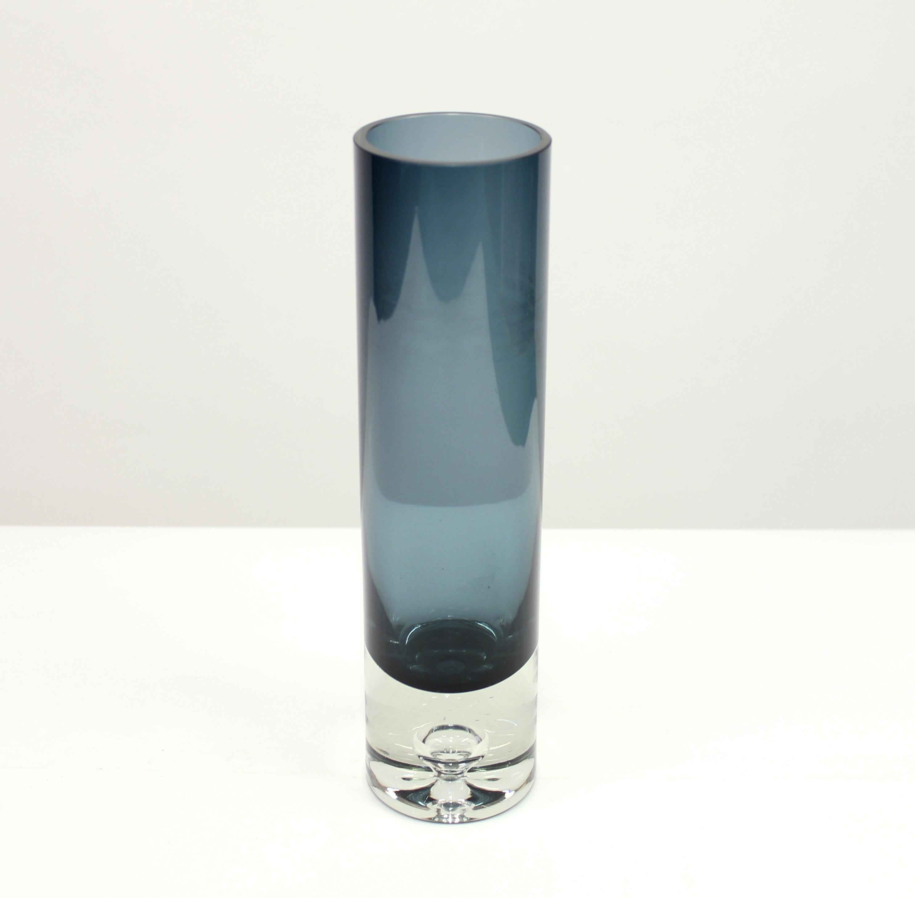 Blue glass vase, model 3586 by Finnish design legend Tapio Wirkkala for Iittala. Beautiful drop decoration inside the foot. Some ware on the inside. Not visible when filled with water. Signed underneath.