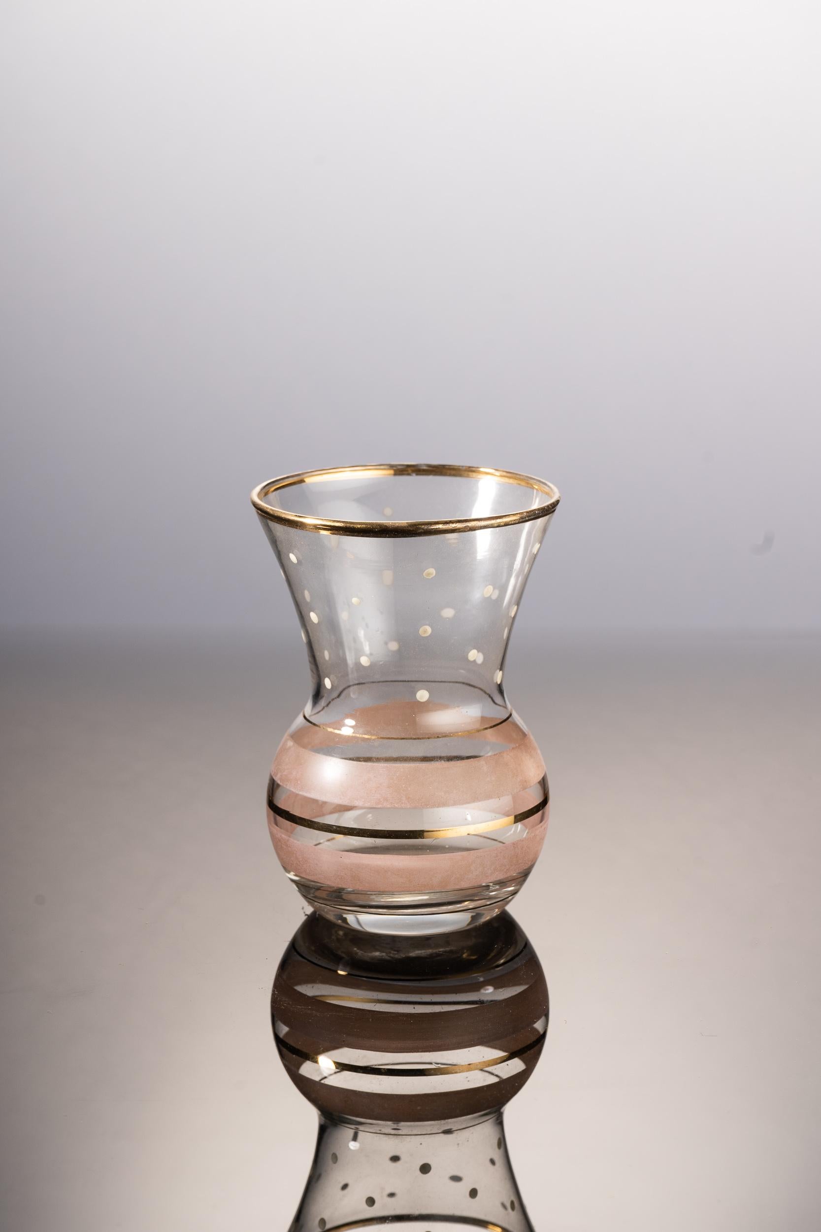 Small vase with white dots and gold red lines.