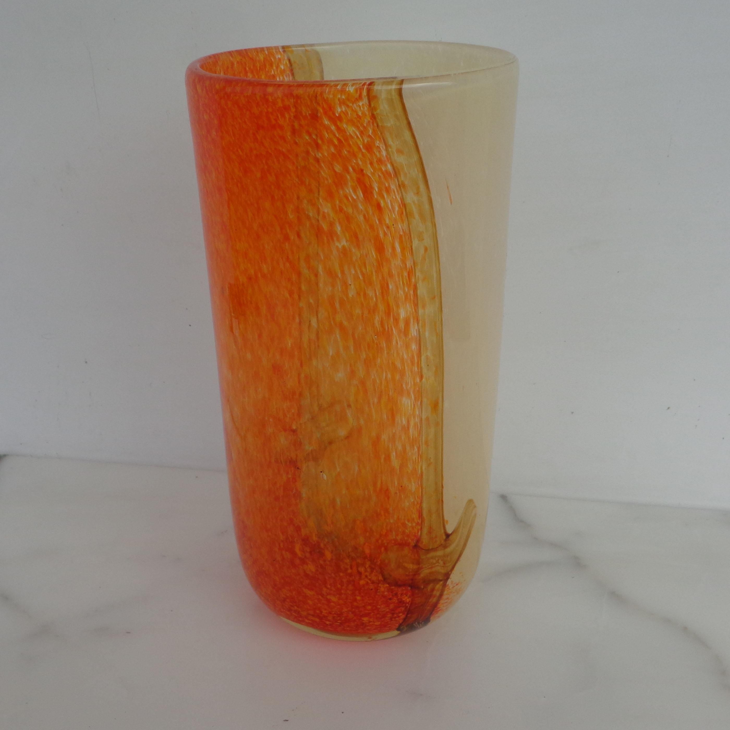 Glass vase in the style of Toni Zuccheri
 
Rich orange, gold and white tones are blended in this circular vase that is attributed to Toni Zuccheri, Venini Murano (Italy).



 