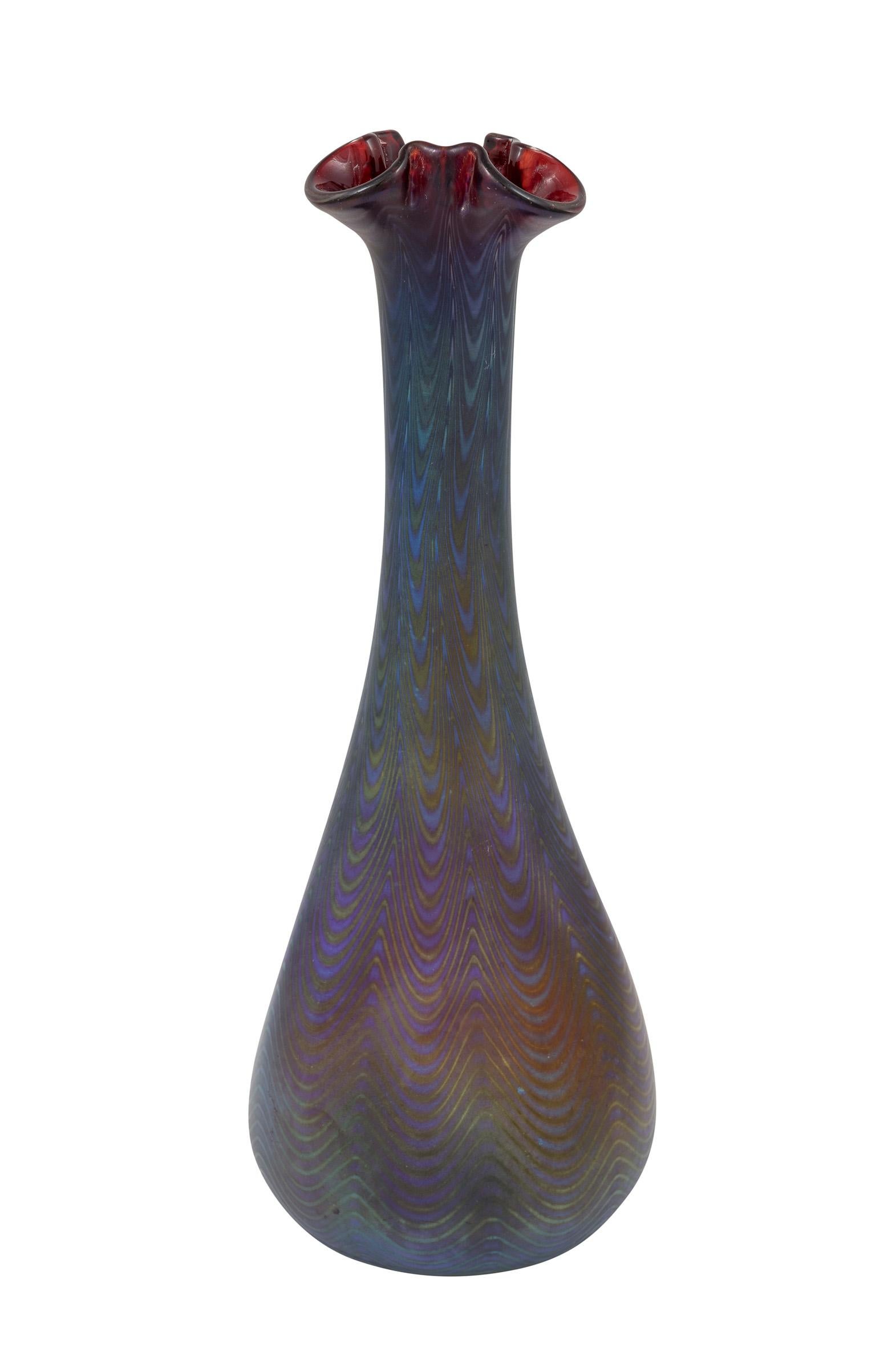Glass vase, manufactured by Johann Loetz Witwe, Rubin 6893 decoration, PN 7468, ca. 1900, Art Nouveau, Jugendstil, Art Deco, art glass, iridescent glass, blue, red

Technique: Glass, mould-blown and freeform, reduced and iridescent

Bib.: E. Ploil,