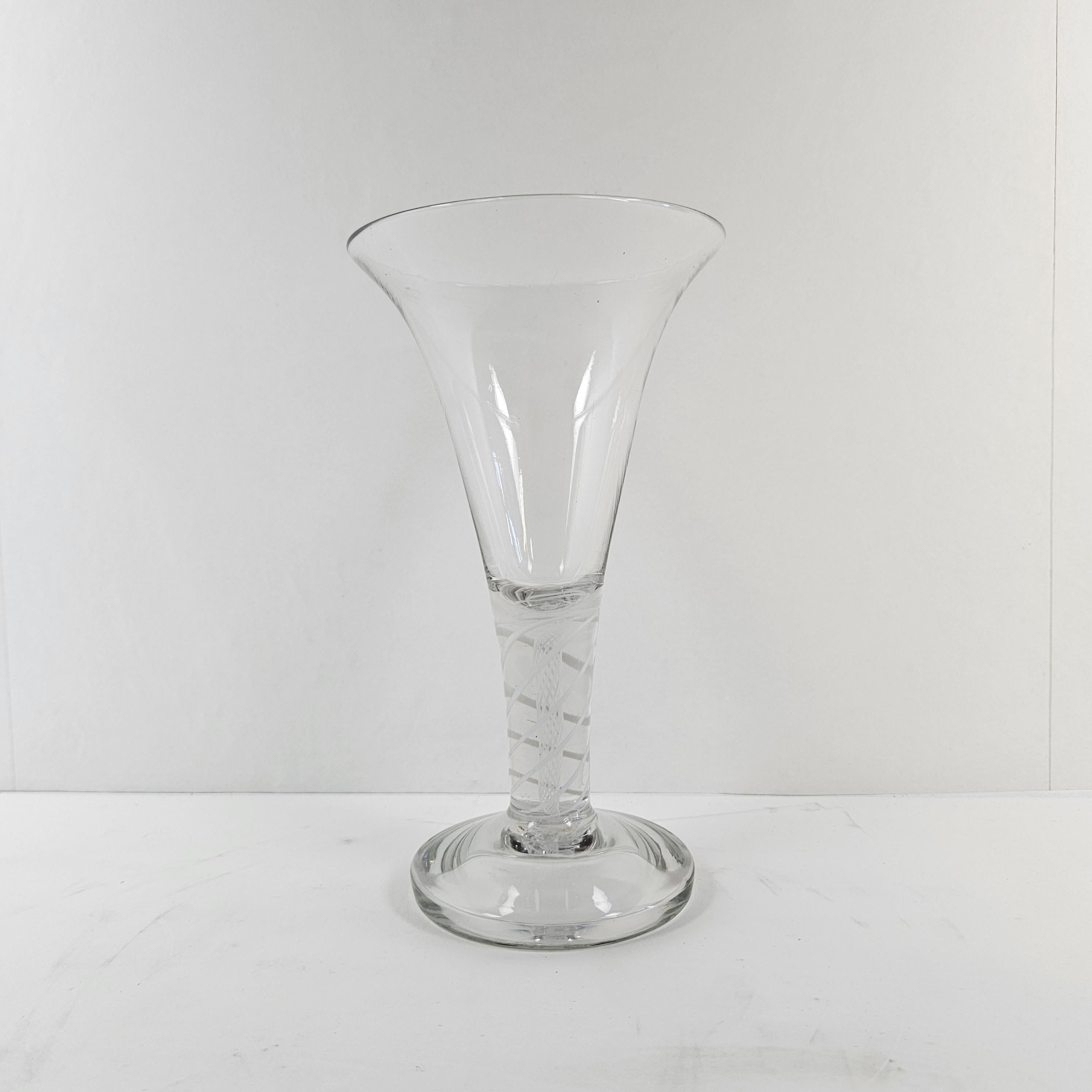 Beautiful glass vase with air twist stem.
This vase is made in The Netherlands in the 20th century.

Please take notice of the very nice details and the elegant design.
Meticulously handcrafted, this exquisite piece showcases the beauty of Dutch