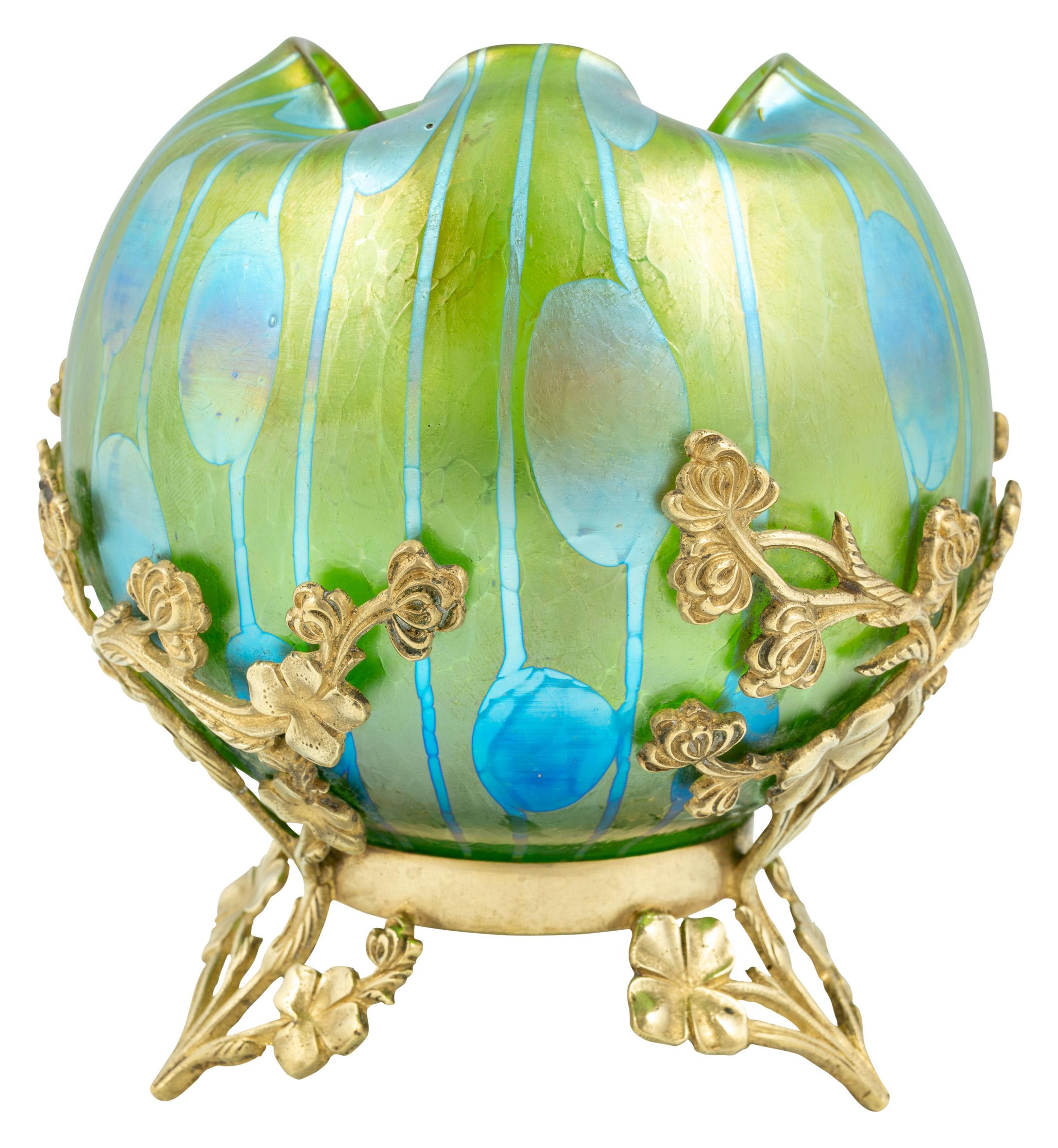 Glass vase with brass fitting, Koloman Moser, manufactured by Johann Loetz Witwe, Streifen und Flecken decoration, ca. 1901, Art Nouveau, Jugendstil, Art Deco, art glass, iridescent glass, blue, green, gold

Technique: Glass, mold blown, free