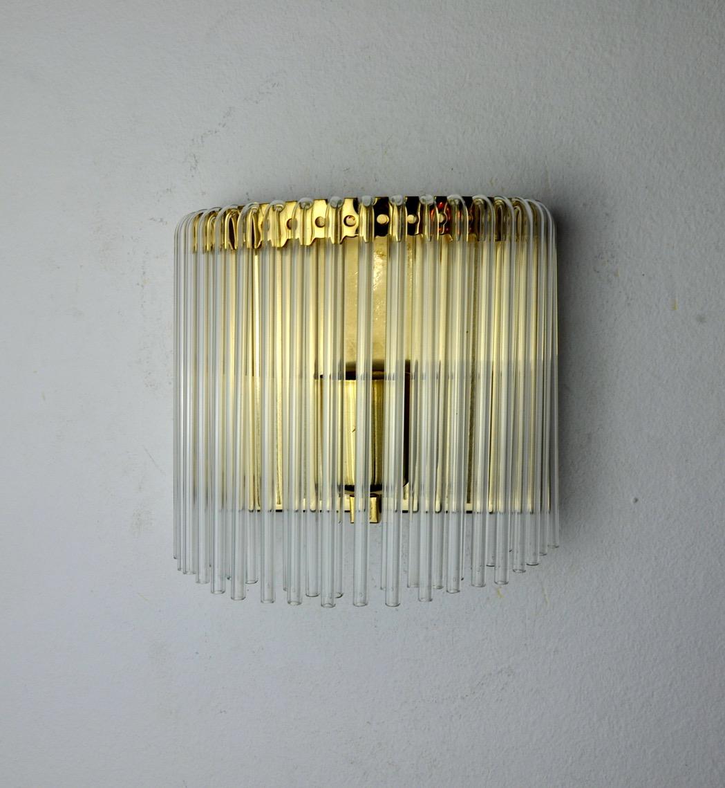 Very beautiful venini wall lamp produced in italy in the 70s. Tubular glass and gilded metal structure. Unique object that will illuminate wonderfully and bring a real design touch to your interior. Electricity checked, mark of time in accordance