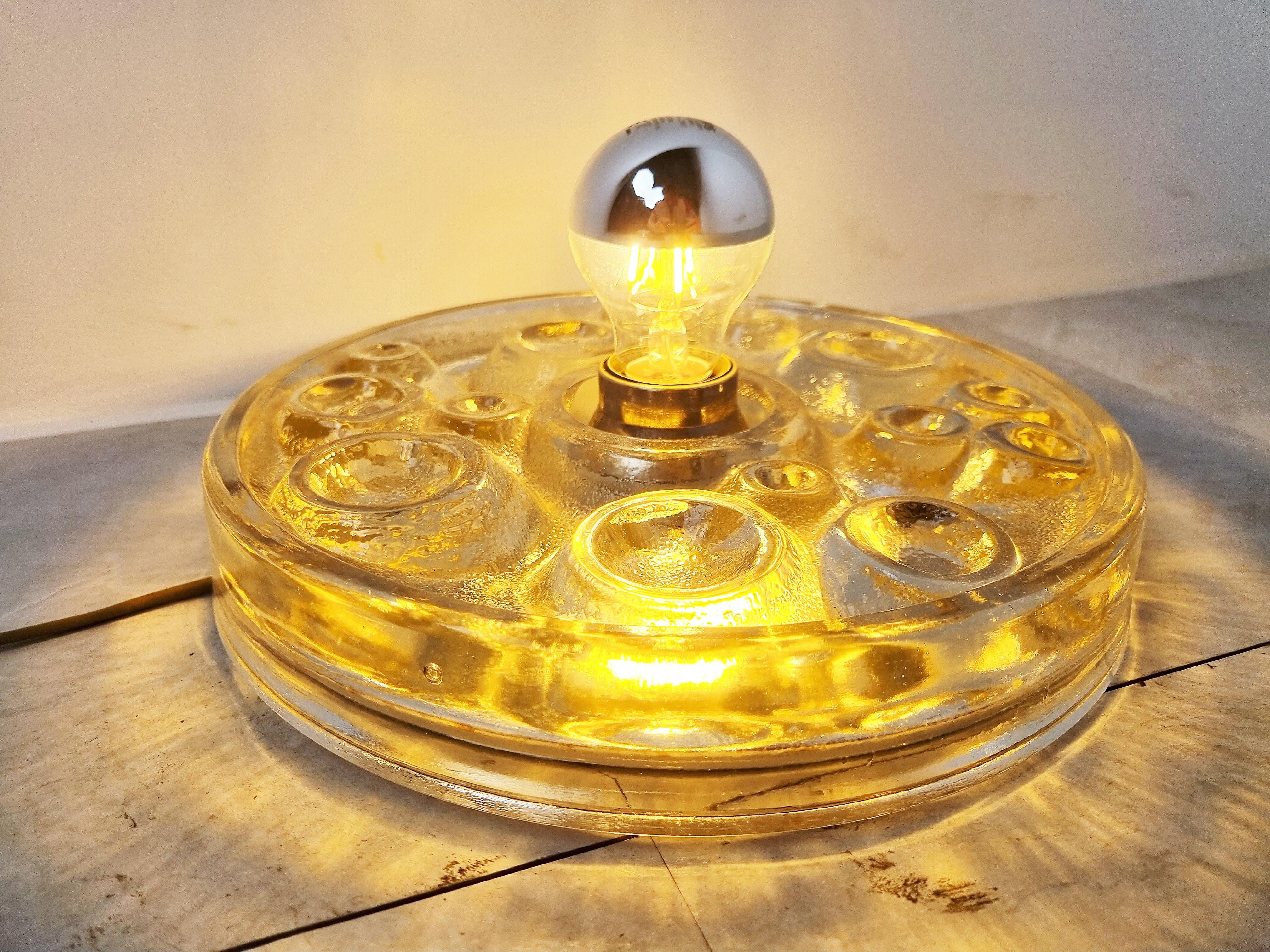 Vintage glass wall or ceiling light by Peil and Putzler.

The lamp emits a beautiful light thanks to its carefully designed glass.

Works with a regular E26/E27 light bulb, US compatible.

1970s - Germany

Dimensions:
Height:
