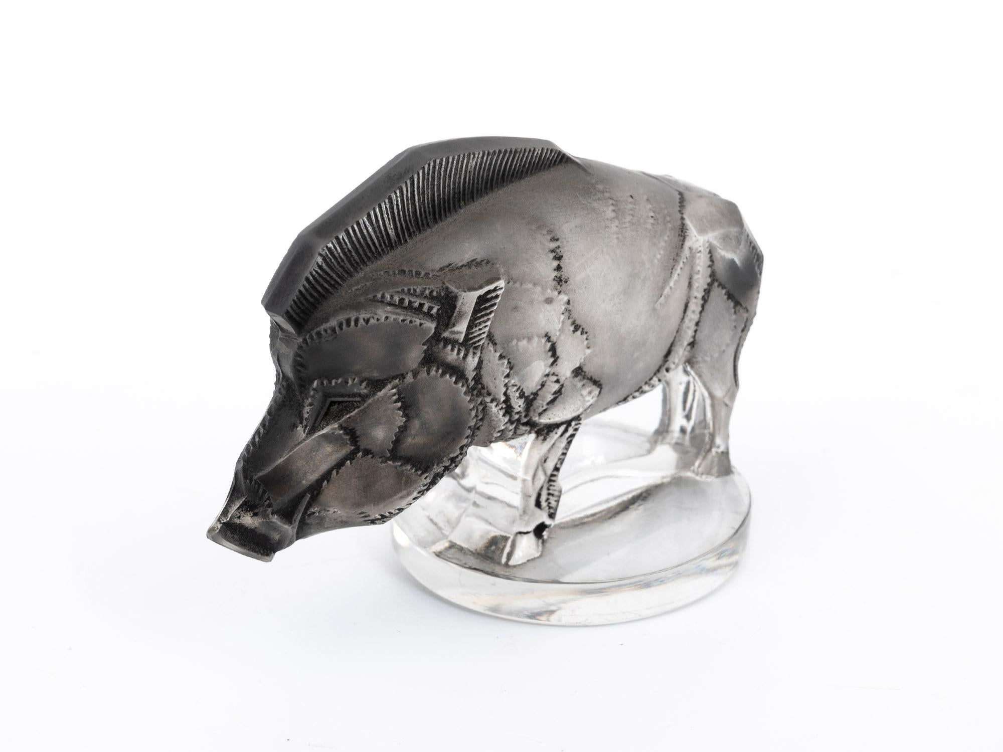 This Sanglier (Wild Boar) car Mascot was designed and produced by renowned glassmaker René Lalique.

Model #1157, René Lalique's car mascot of the Sanglier (wild boar) is a striking display piece.

An exceptionally beautiful black and grey