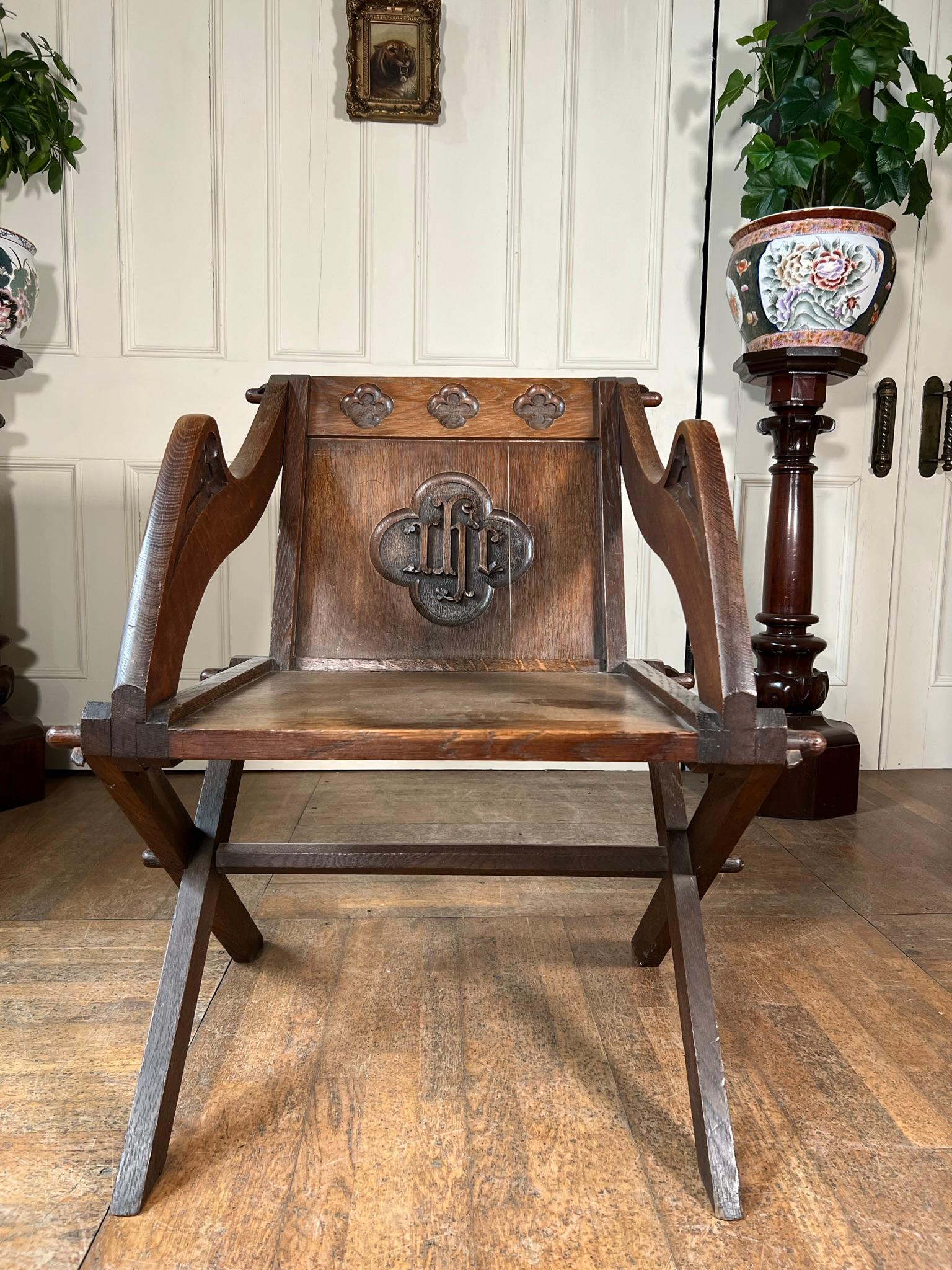 Folding x-base chair commonly known as the Glastonbury chair.

This example dates to the early 20th century.

Constructed from oak probably once sat at an altar.

Great looking functional piece of ecclesiastical furniture.

Measurements - 84cm h x