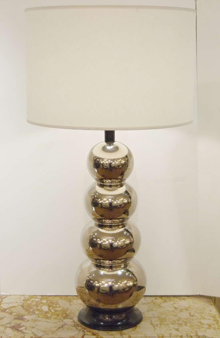 Elegant ceramic lamp with wooden base. A wonderful addition to all decors. Warm silver tone

Lamp shade not included. New wiring. Height listed is with 11