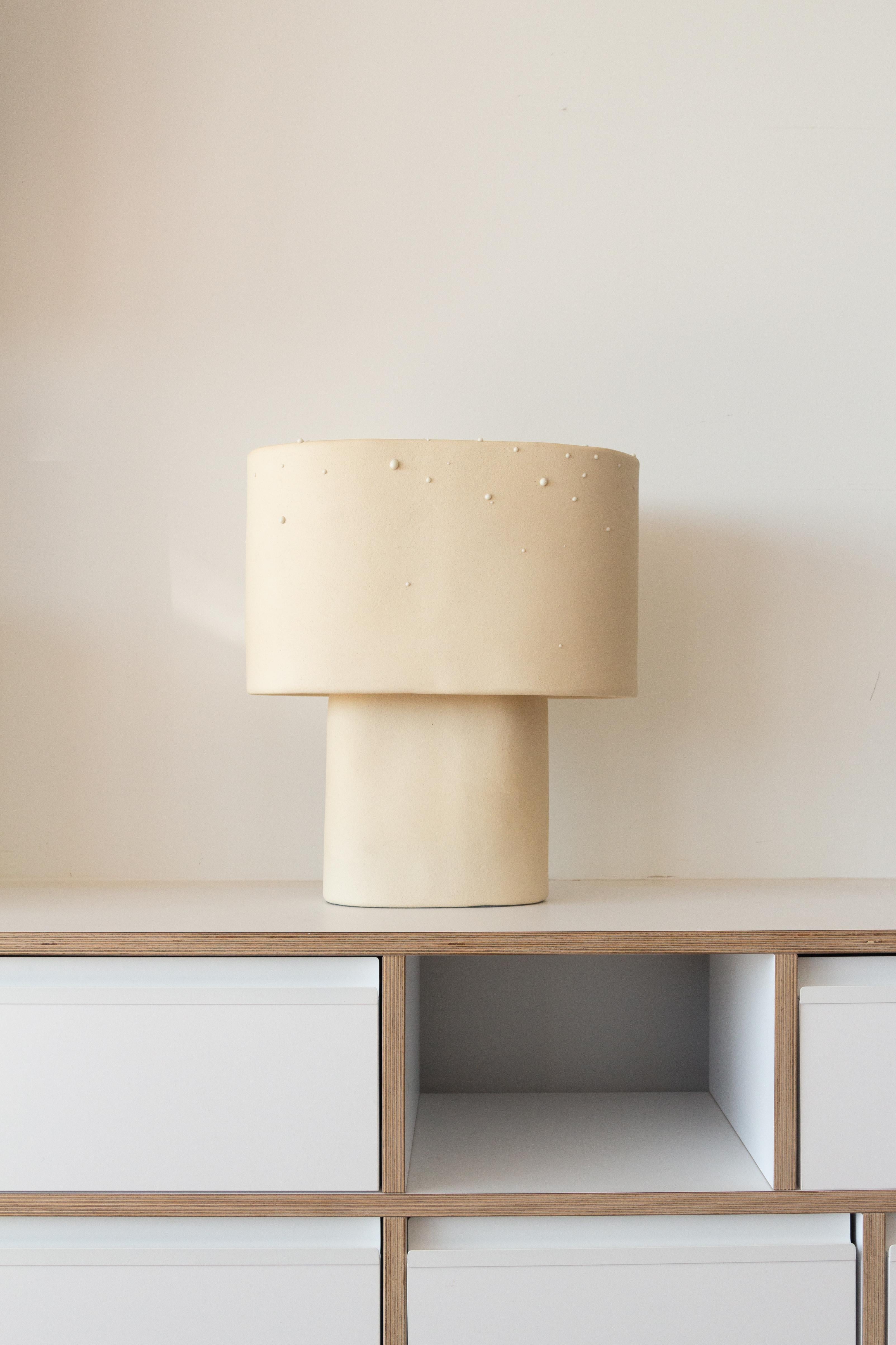 Glaze Stoneware Table Lamp by Lucas Huillet
Dimensions: D 38 x W 35 x H 38 cm
Materials: Stoneware and drops effect glaze.
Weight: 8 kg.


Lucas Huillet is an artisan designer.
He bases his practice around the cross-disciplinarity between artisanal