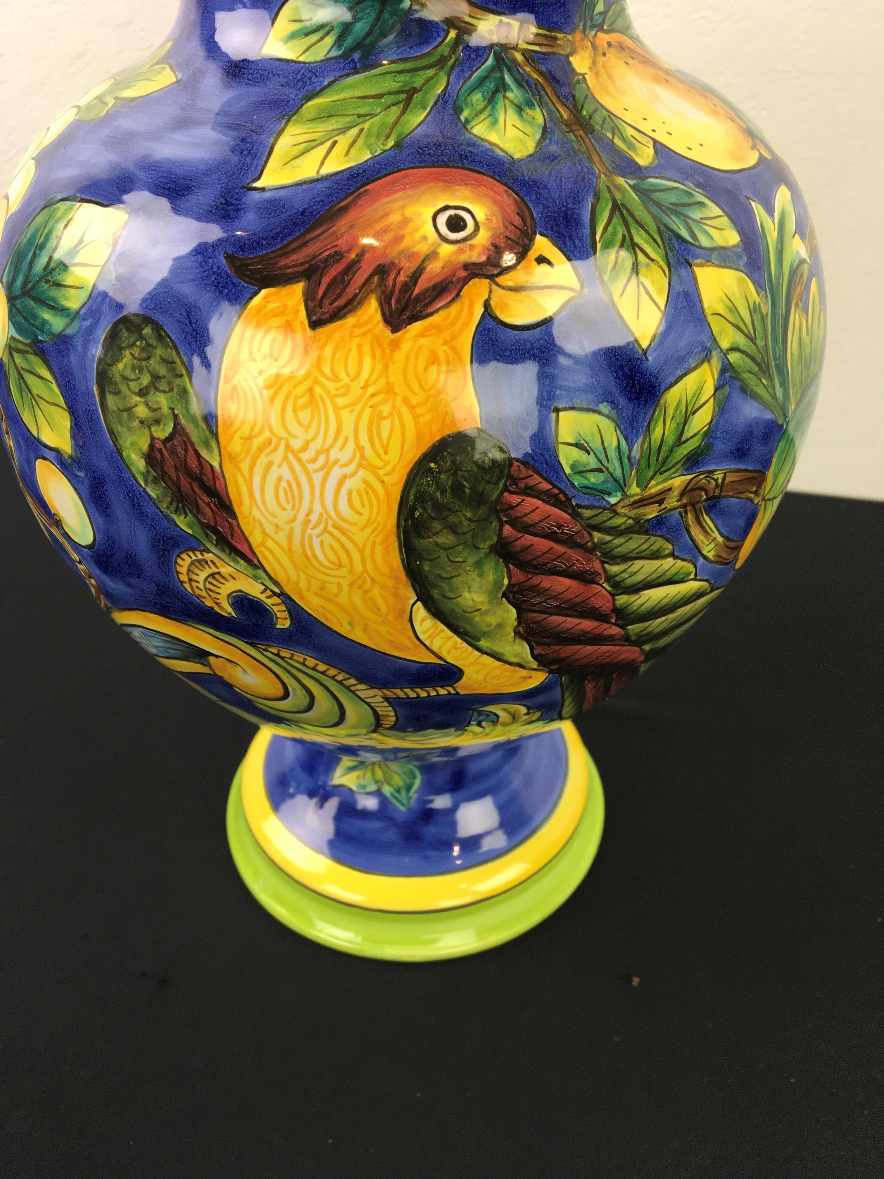 Blue jar with a bird and lots of lemons, flowers and leaves.
A ceramic jar with lid with a beautiful bird in a lemon tree. 
Beautiful glazed blue jar with lid, pot with lid, urn. 
Mediterranean design - mediterranean style - Italian style.
