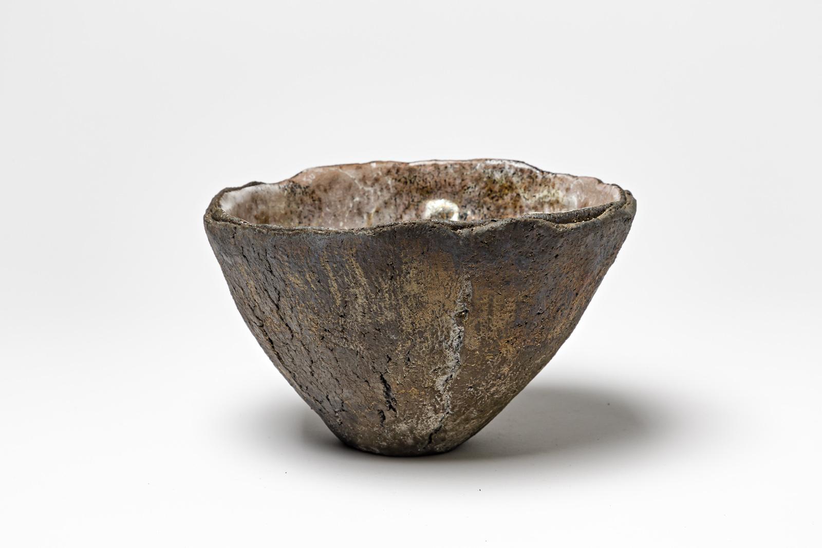 Glazed ceramic bowl with pearly white interior by Gisèle Buthod Garçon. 
Raku fired. 
Artist monogram et signature under the base. 
Circa 1980-1990. 
H : 4.3’ x 7.5’ inches.
