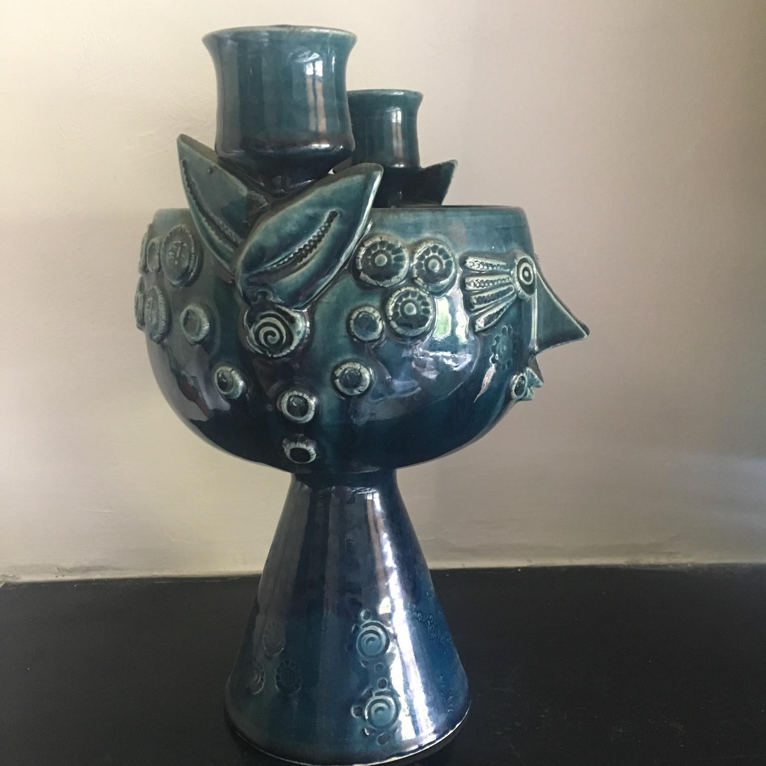 This is a very fine early example of Danish artist Bjørn Wiinblad's work for Rosenthal. Double candleholder surrounding one central vessel with decorative face. Combine it with other candle holders for a charming midcentury or Bohemian look.