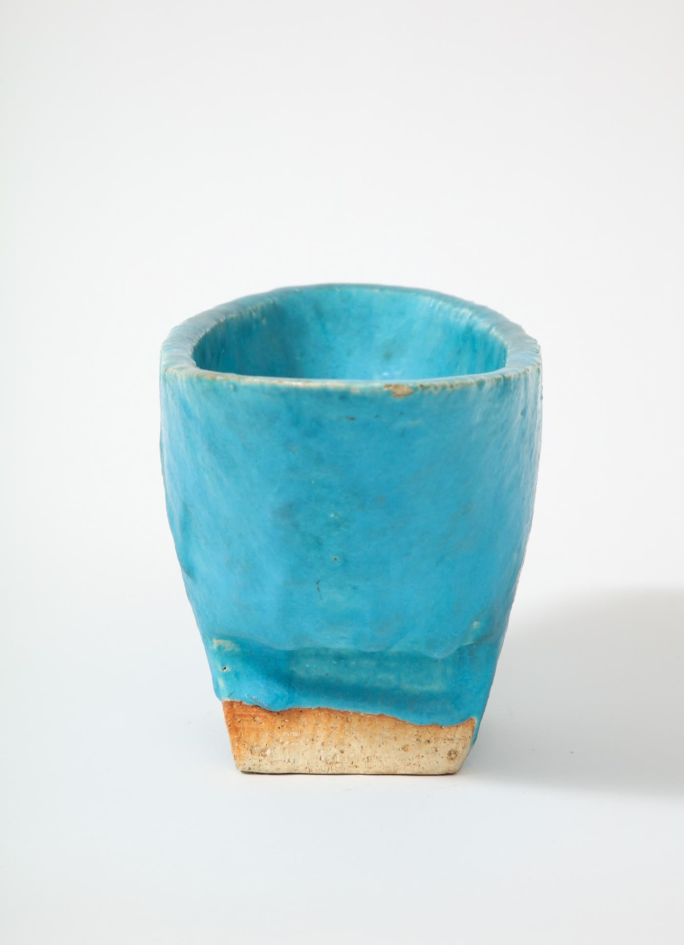 Glazed Ceramic Footed Vessel, Japan, 20th C.

Striking blue bowl/vessel with a unique shape. The thick glaze sits beautifully on substantial, hand formed stoneware.