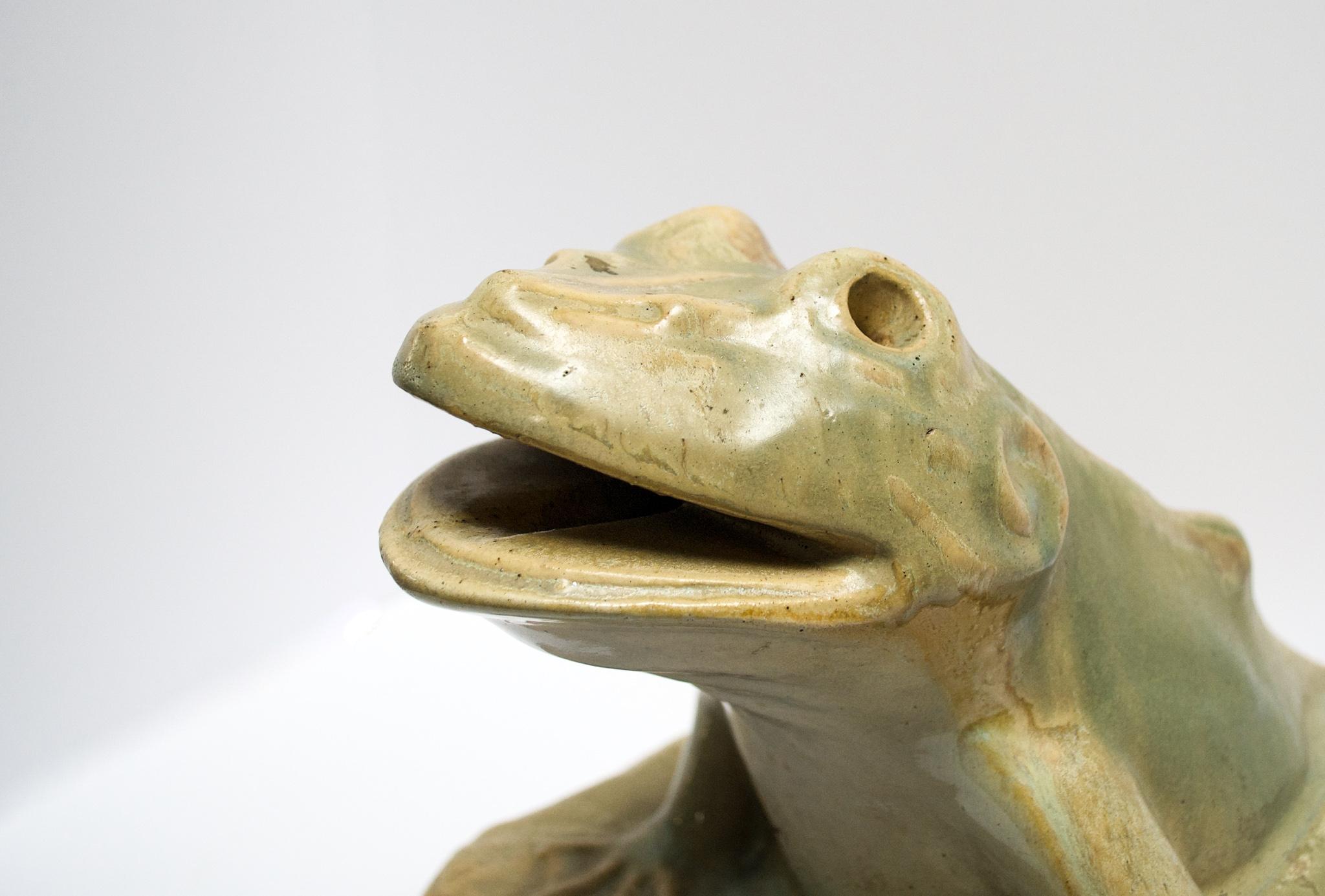 This vintage ceramic frog fountain is a charming statue that can be used in a water feature or Stand alone as a hidden garden friend. Opening at base to the mouth can be used as a water exit. Features beautiful multicolored glazed surface on