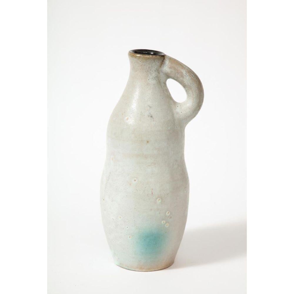 Glazed Ceramic Pitcher, France, 20th Century

Beautifully textured hand-thrown ceramic jug with a translucent glaze that moves between creamy white, to lightly glazed beige.

Additional Information:
Materials: Glazed Ceramic
Origin: France
Period: