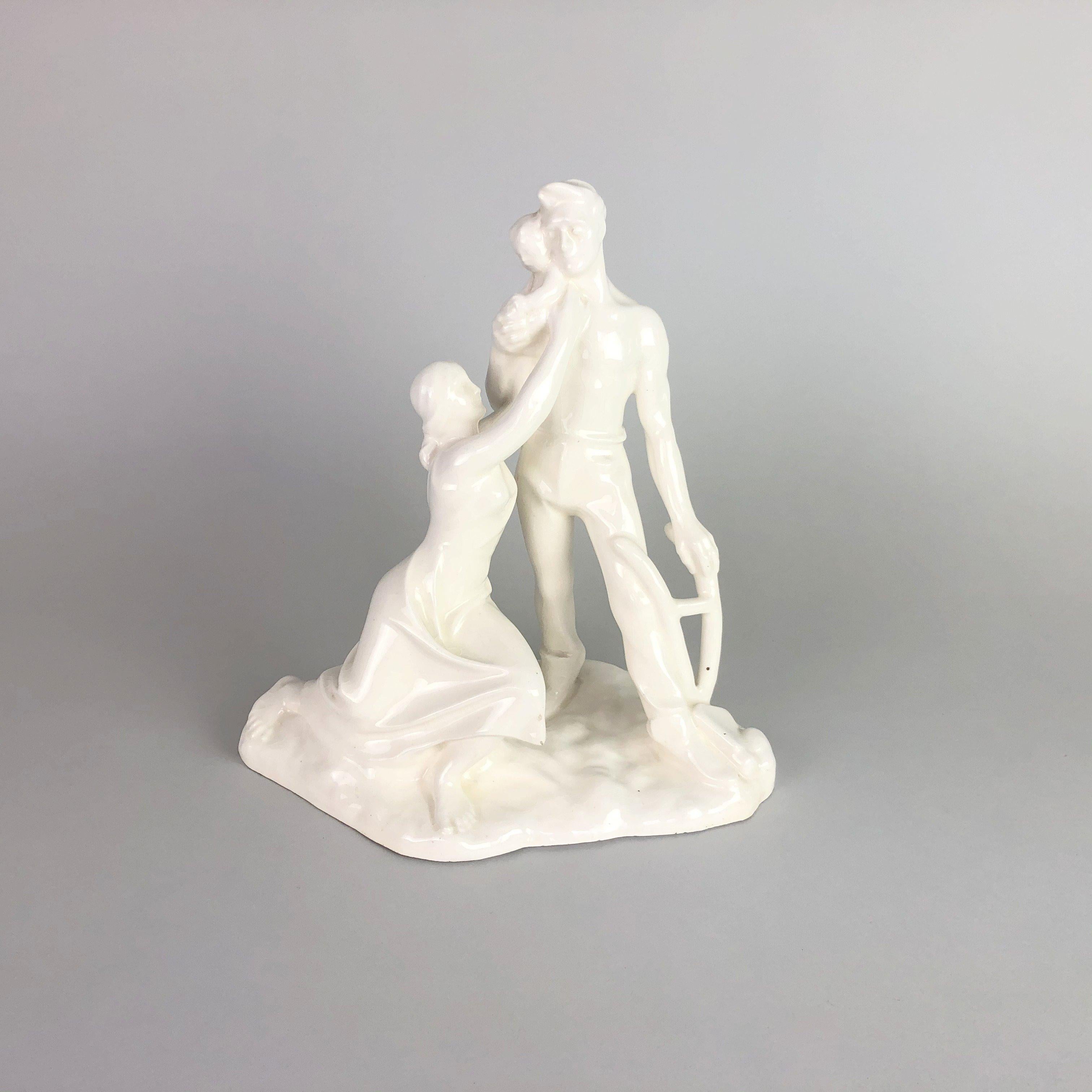 Vintage glazed ceramic sculpture of a young family. Signed by the author „Emil Hlavica Brno