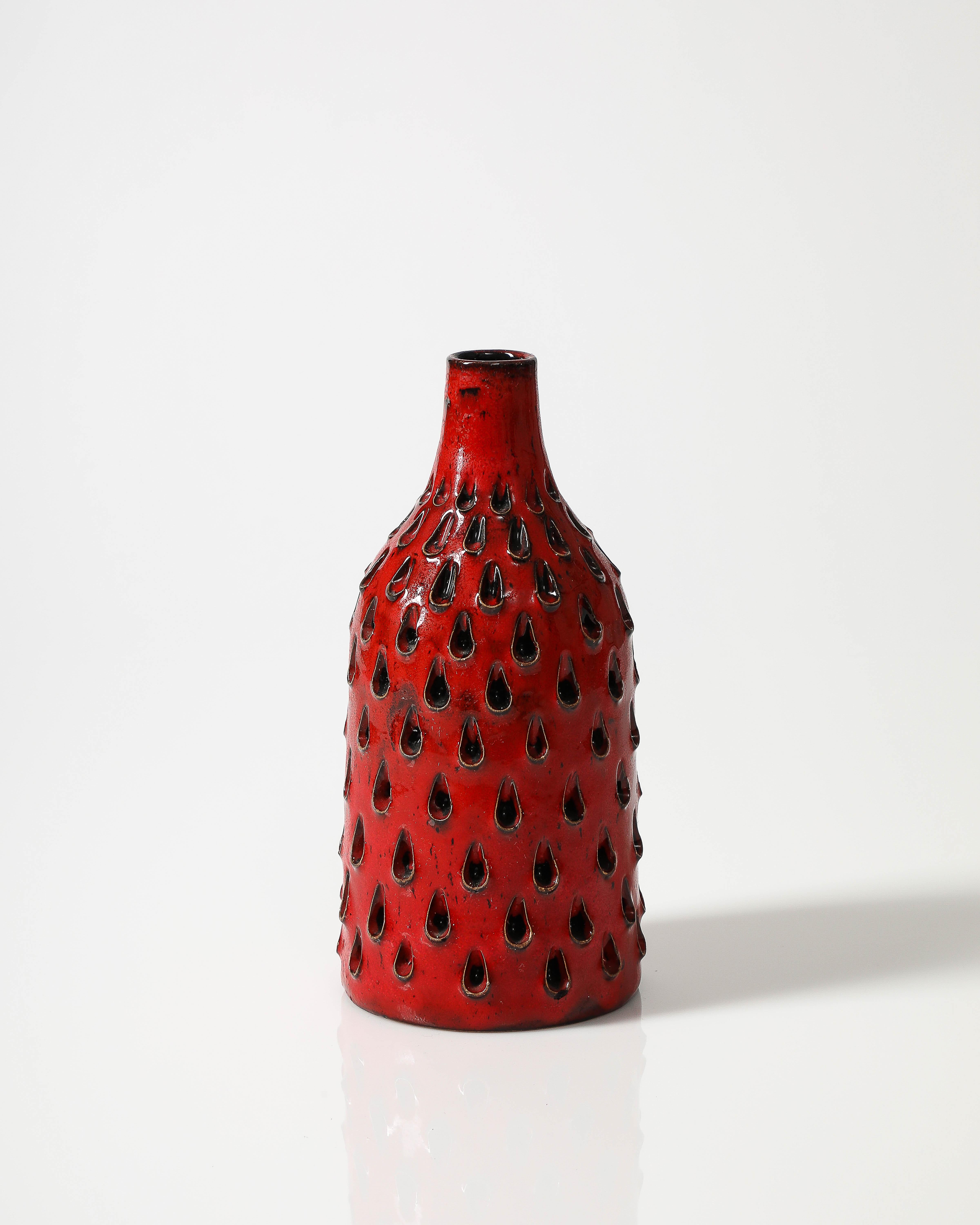 Beautifully textured red ceramic vase.