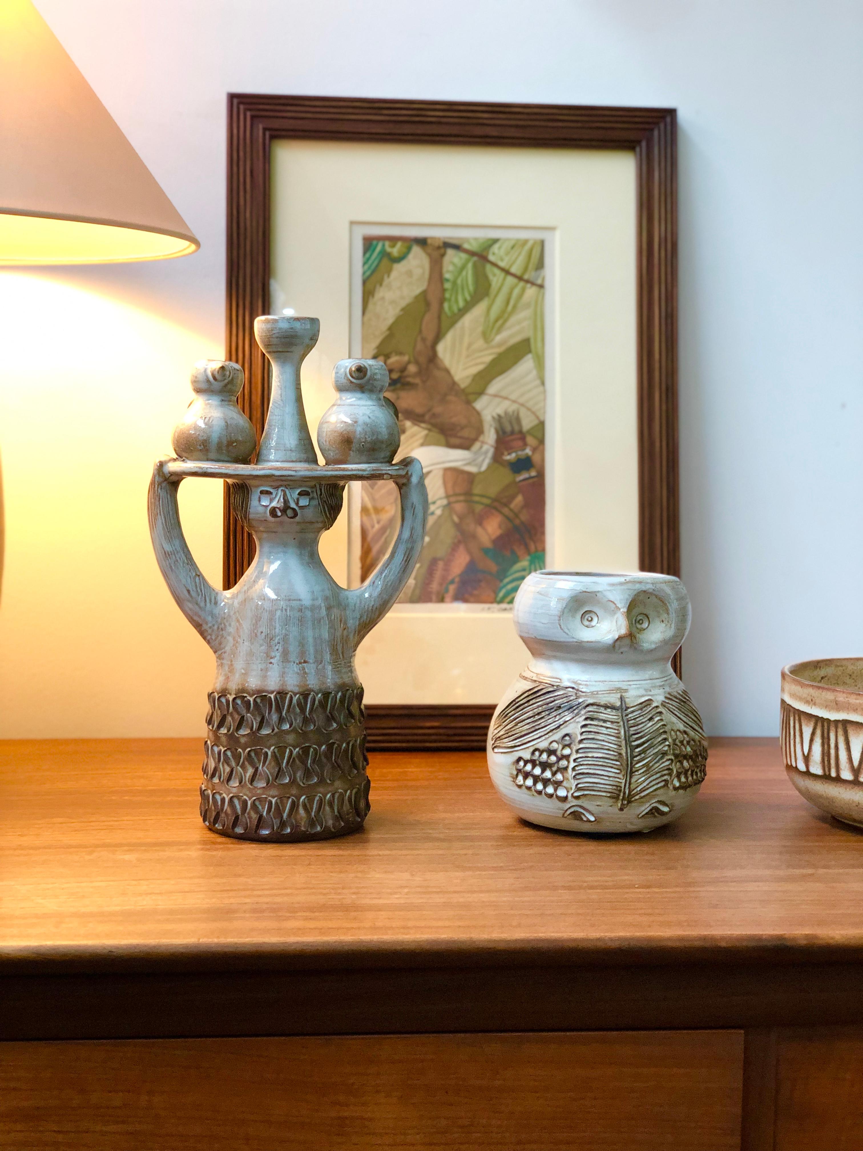 Glazed ceramic, stylised owl vase (circa 1960s) by Jacques Pouchain (1925-2005). This is a whimsical, ceramic sculpted vase in Pouchain's inimitable style. The rounded base is decorated with etched owl's wings and body features topped by a smaller