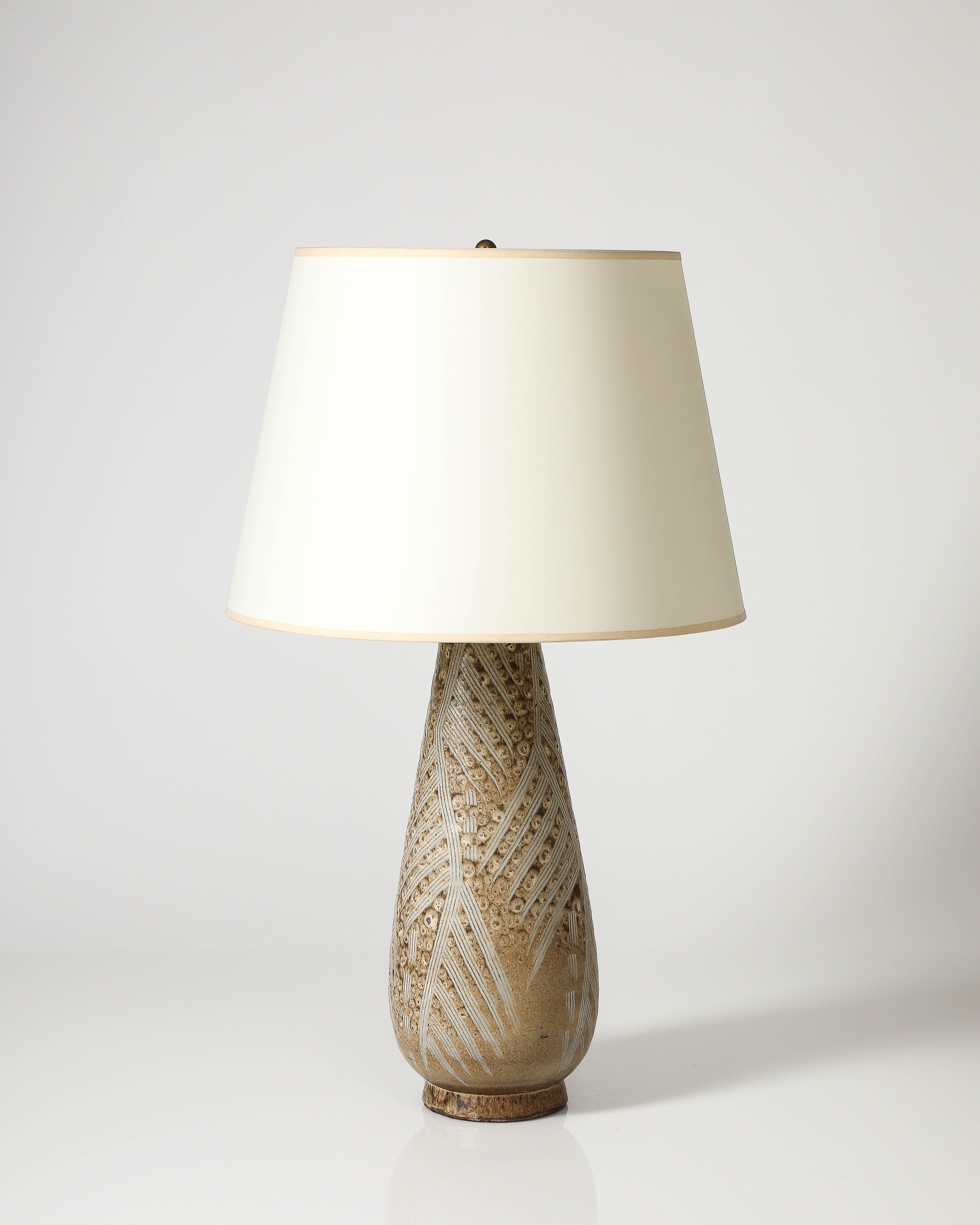 Glazed ceramic table lamp with a unique texture, by Design Technics.