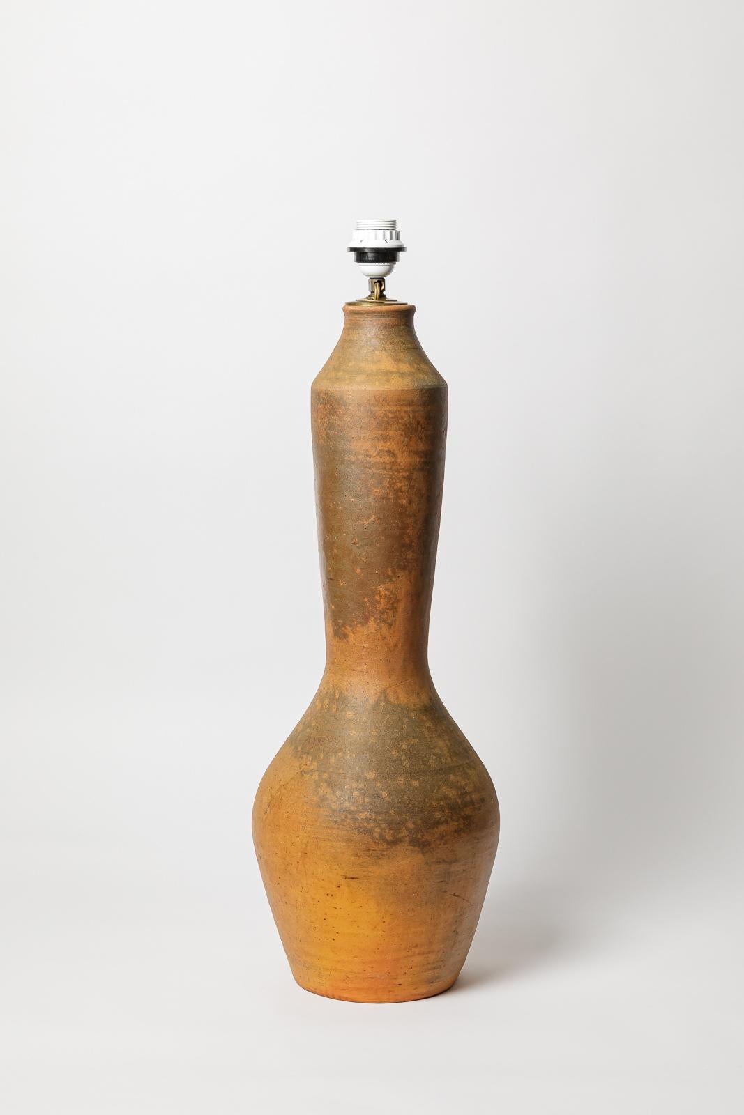 Glazed ceramic table lamp by La Borne. 
Artist signature under the base. Circa 1940. 
H : 27.2 x 9.4 inches (ceramic only).
Sold with a European electrical system.