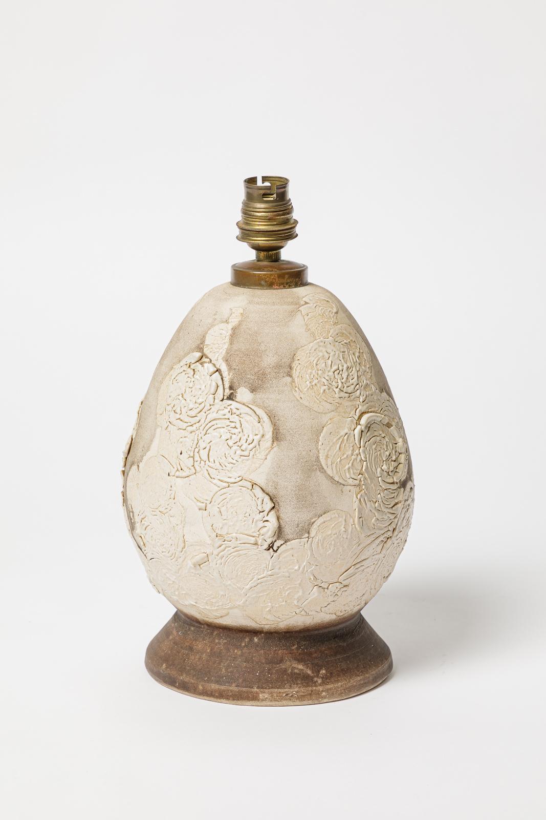 Glazed ceramic table lamp.
Artist signature under the base. Circa 1930. 
H : 8.7 x 5.3 inches (ceramic only).
Sold with a European electrical system.